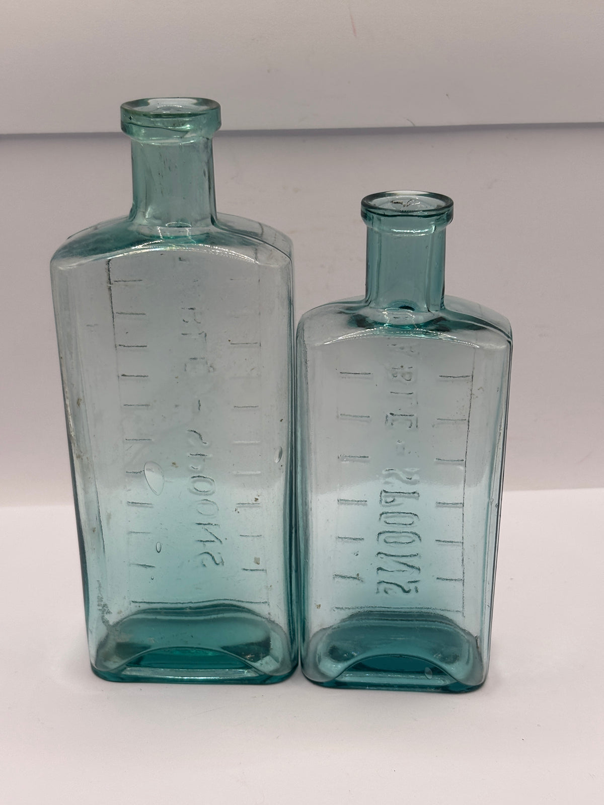 2 old aqua glass medicine bottles, table spoons