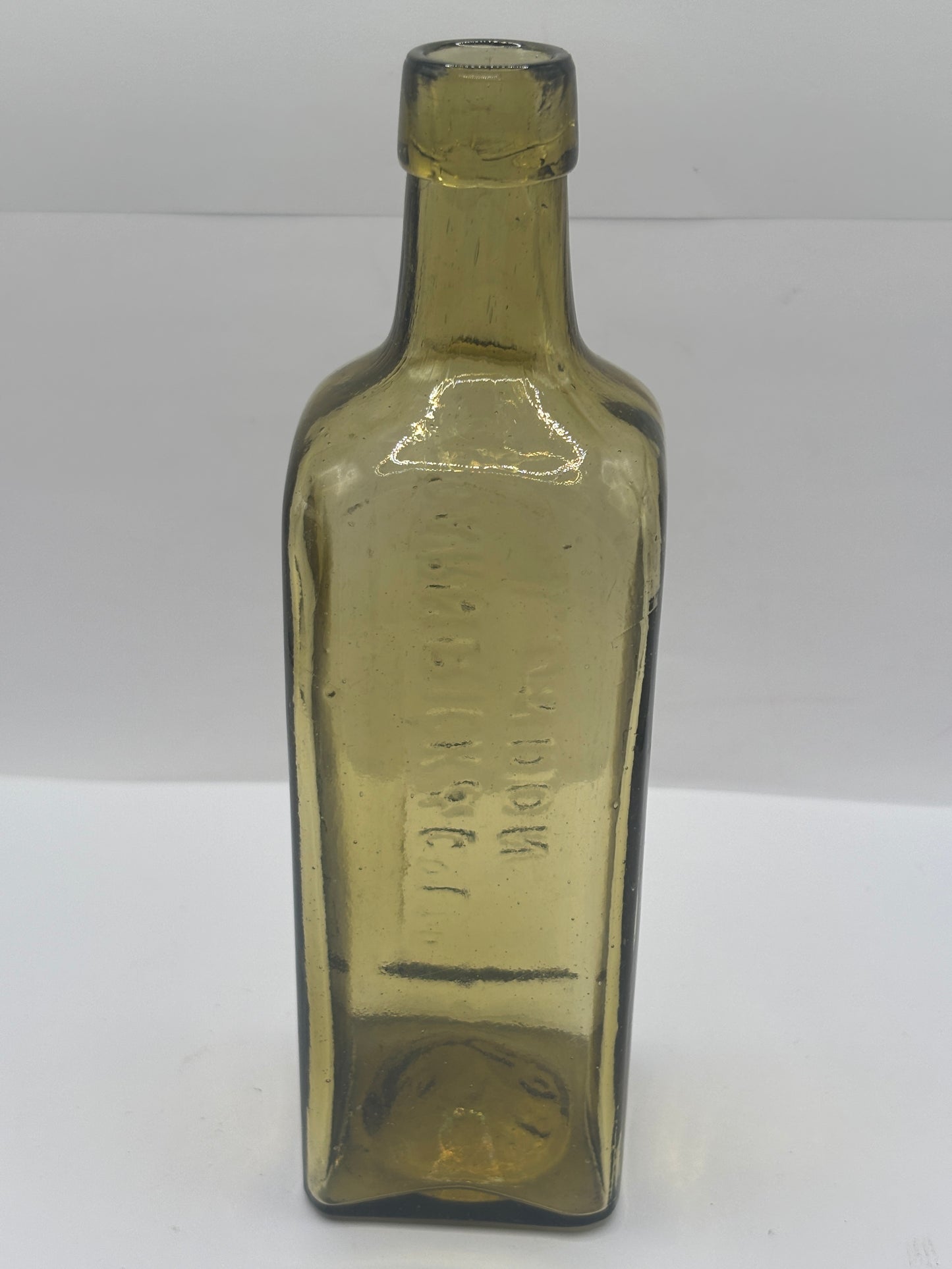 Old glass advertising chemist bottle, London