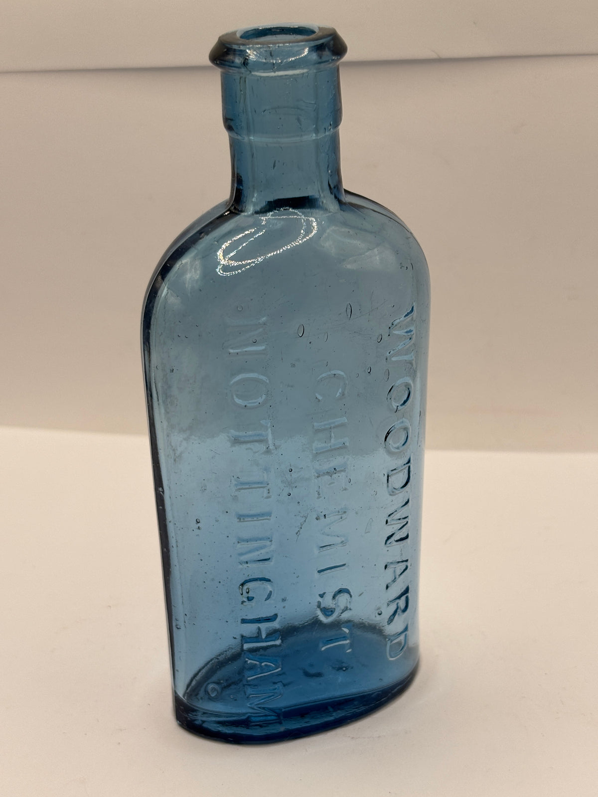 Old blue glass chemist bottle, Woodwards chemist Nottingham