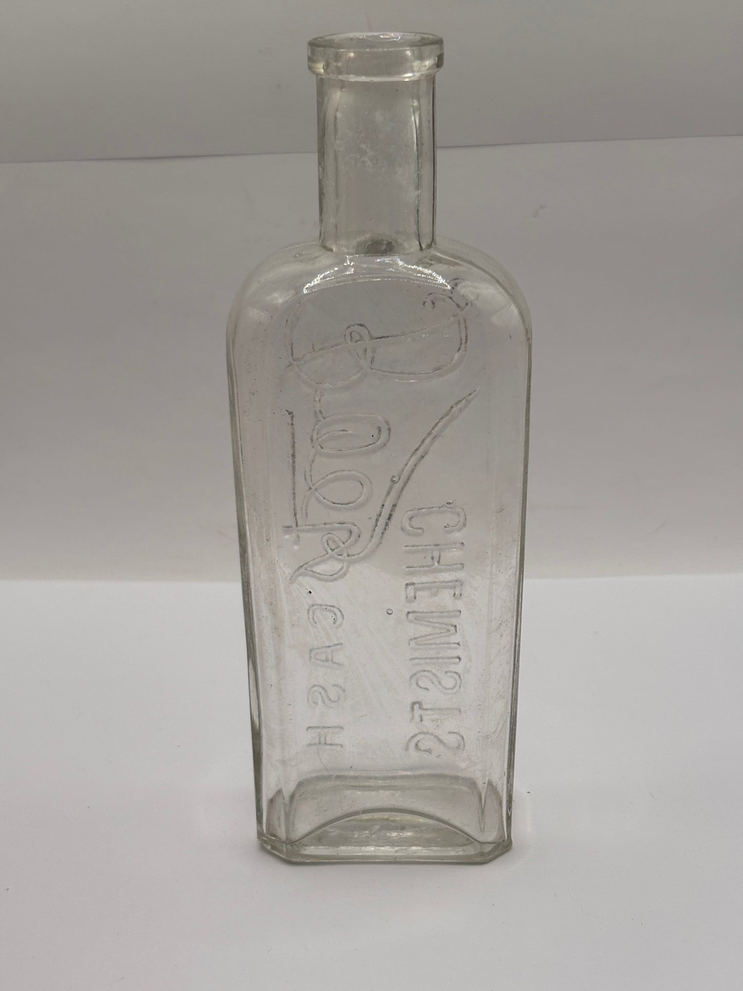 Old clear glass Boots cash chemists bottle