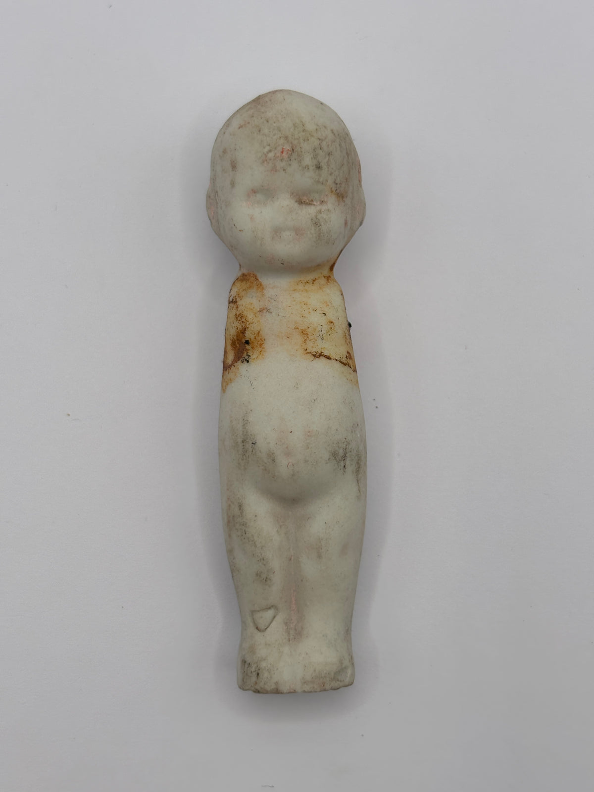 Old crusty small doll, armless