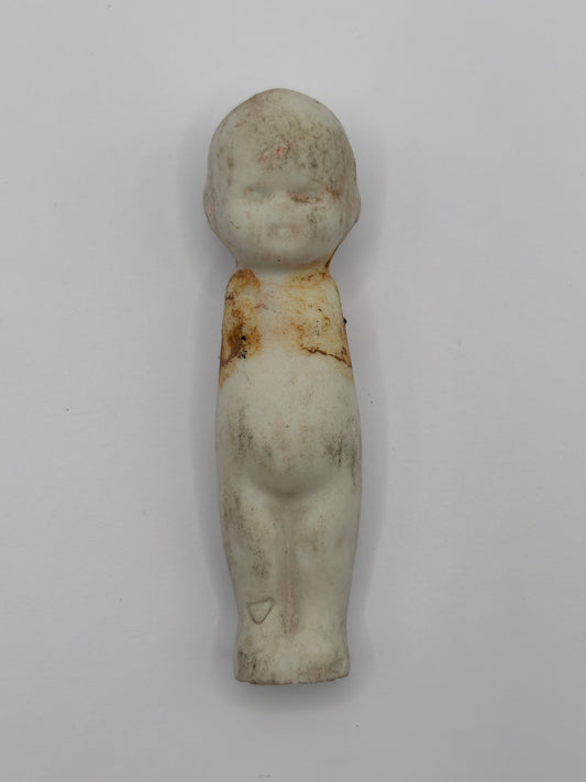 Old crusty small doll, armless