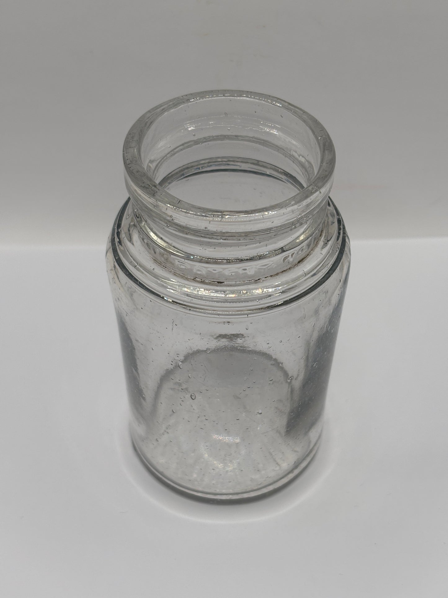 Old clear glass pickle jar