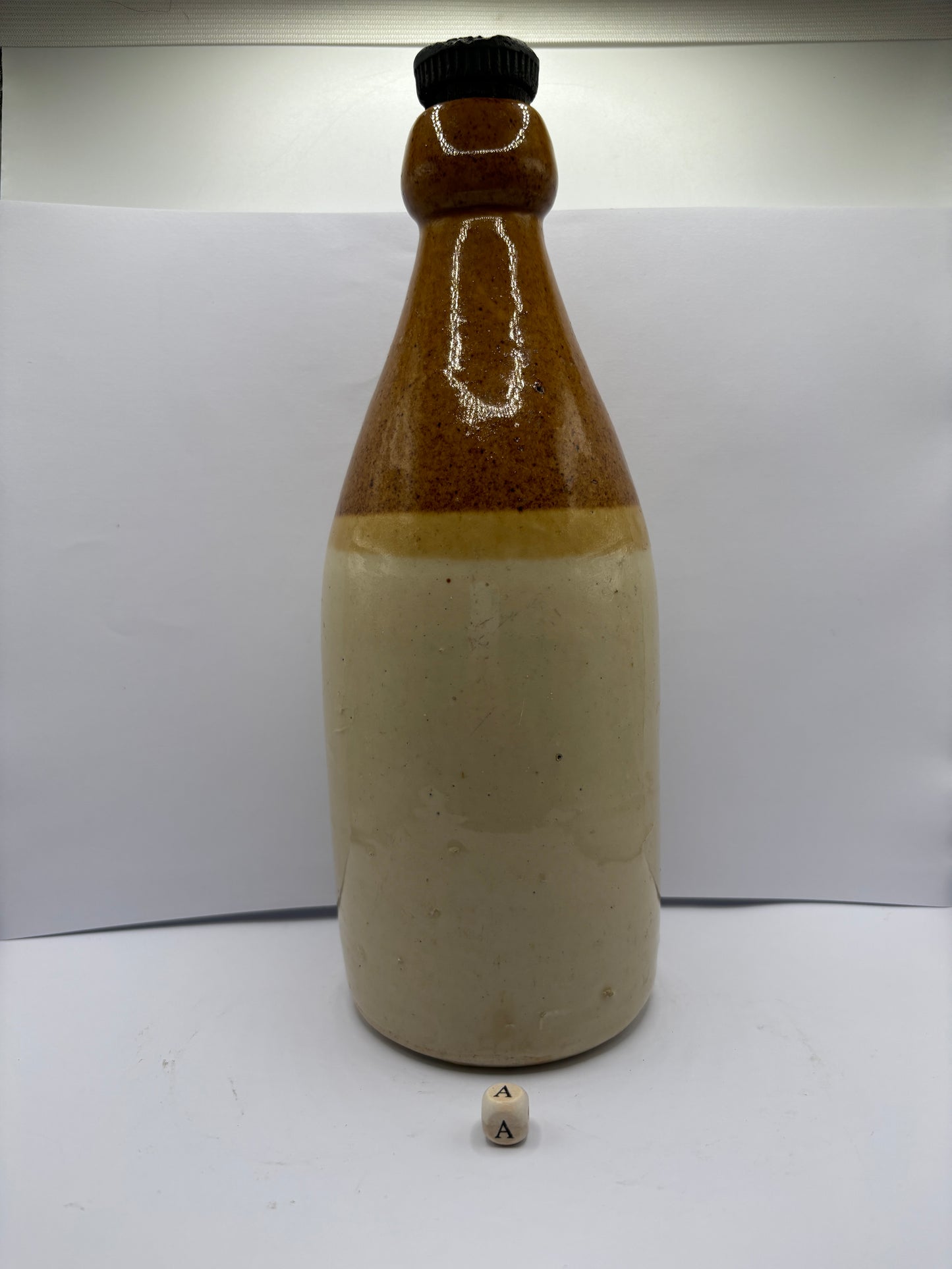 Large plain stoneware ginger beer bottle (a)