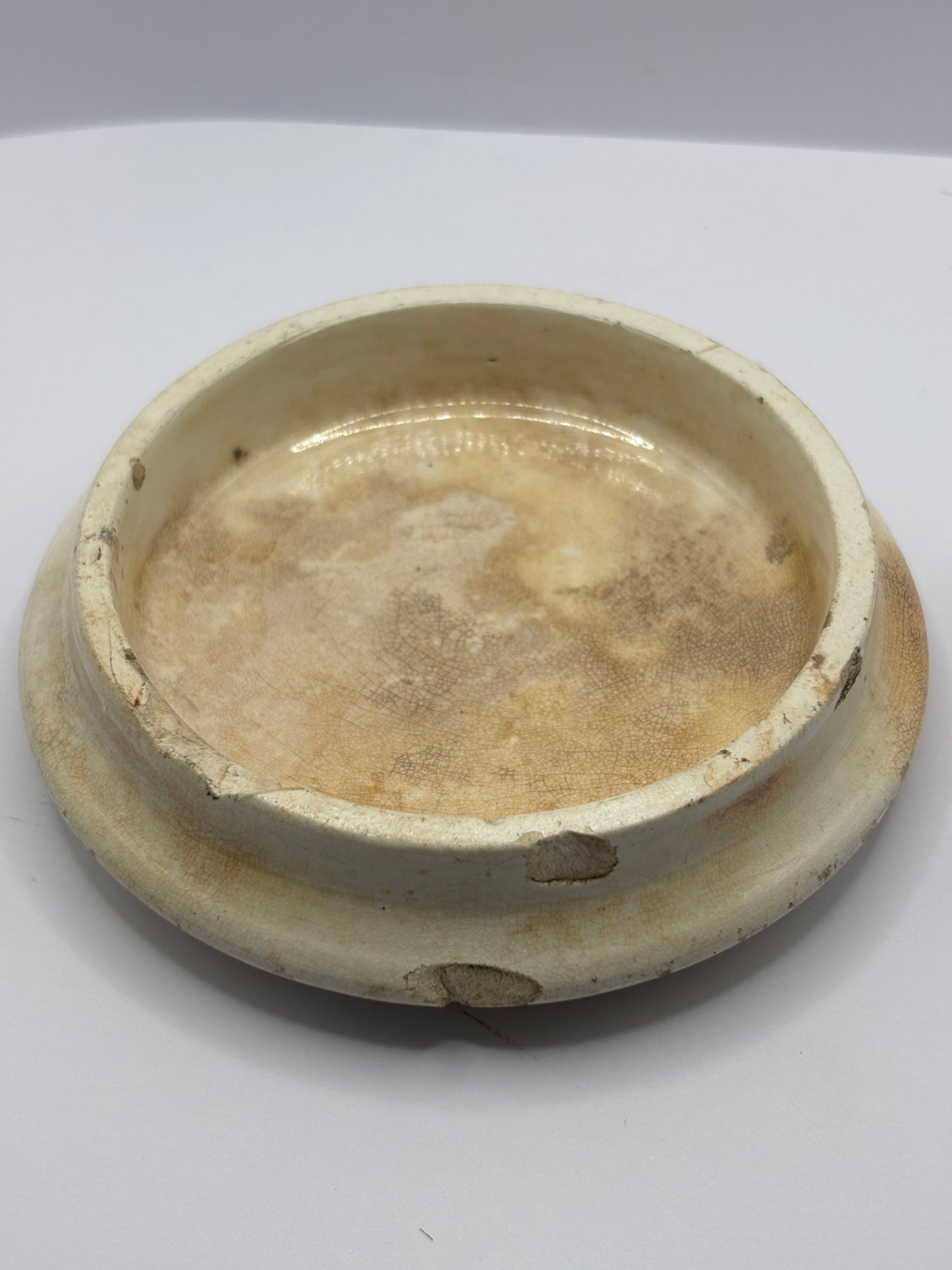 Old anchovy paste advertising pot lid, stained & crazed