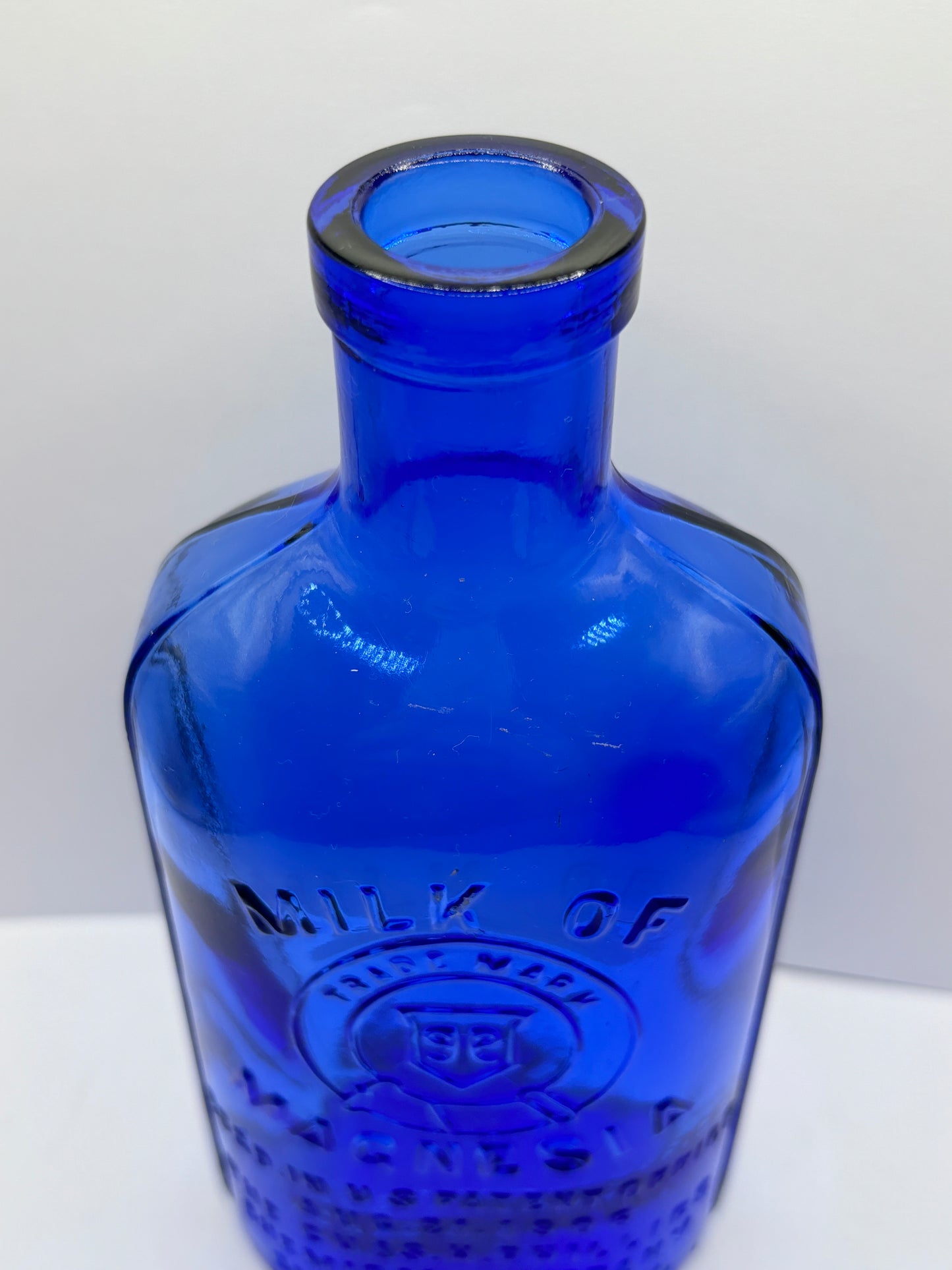 Old blue milk of magnesia bottle