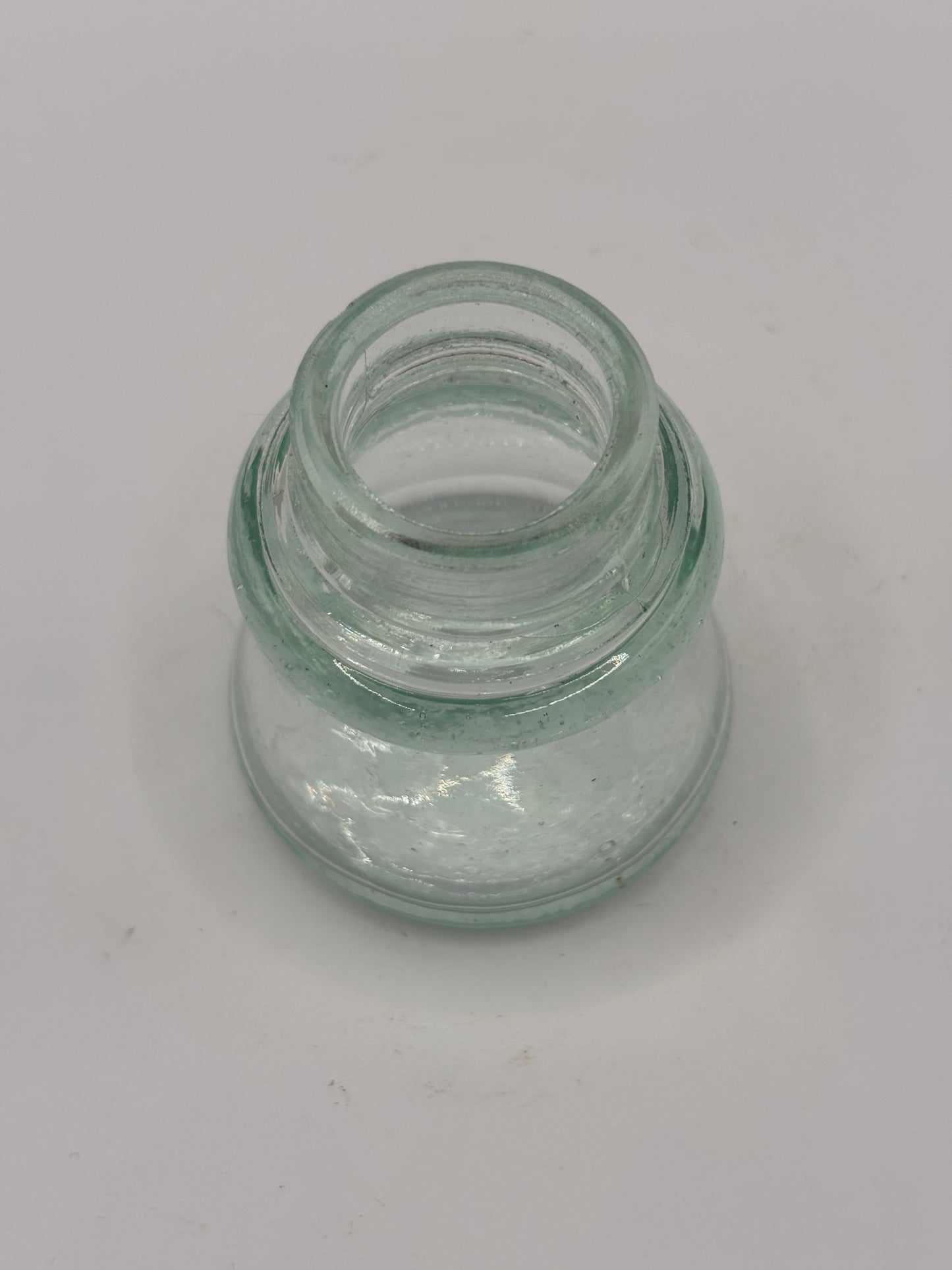 Old aqua glass inkwell. Ink bottle