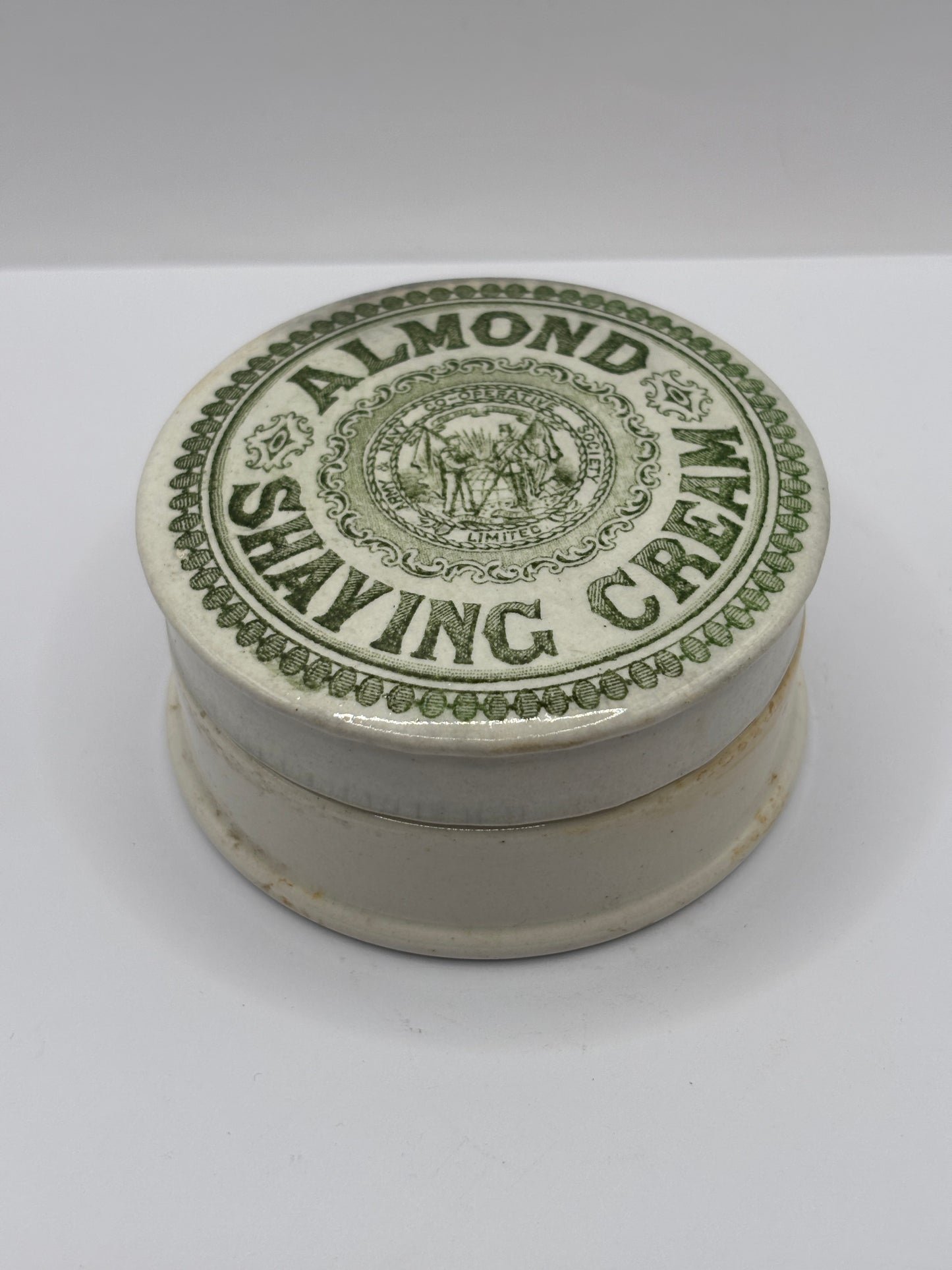 Old green print advertising lid and base, Almond shaving cream