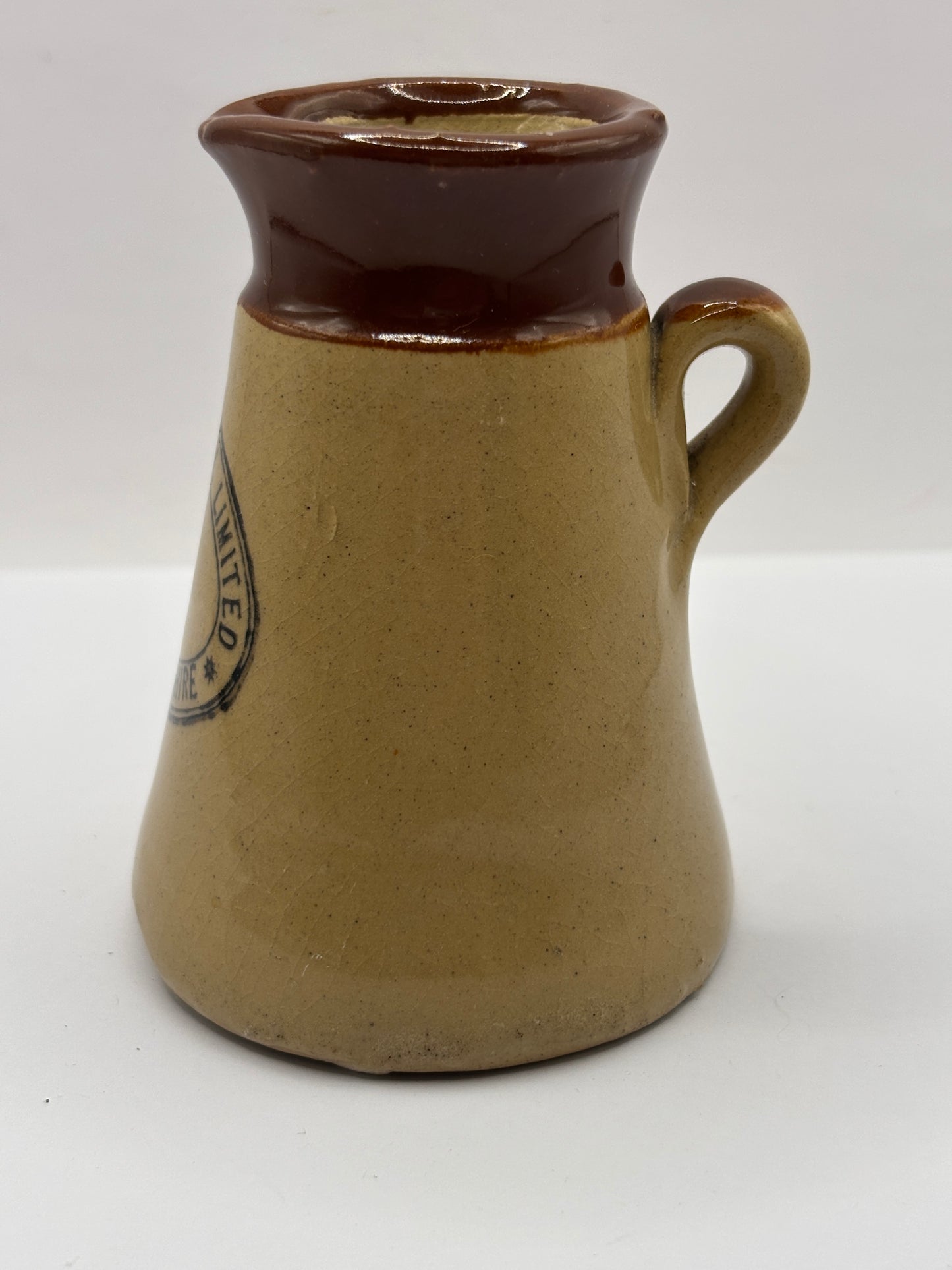 Old stoneware advertising cream pot, Helsby Creamery. Cheshire. Handled
