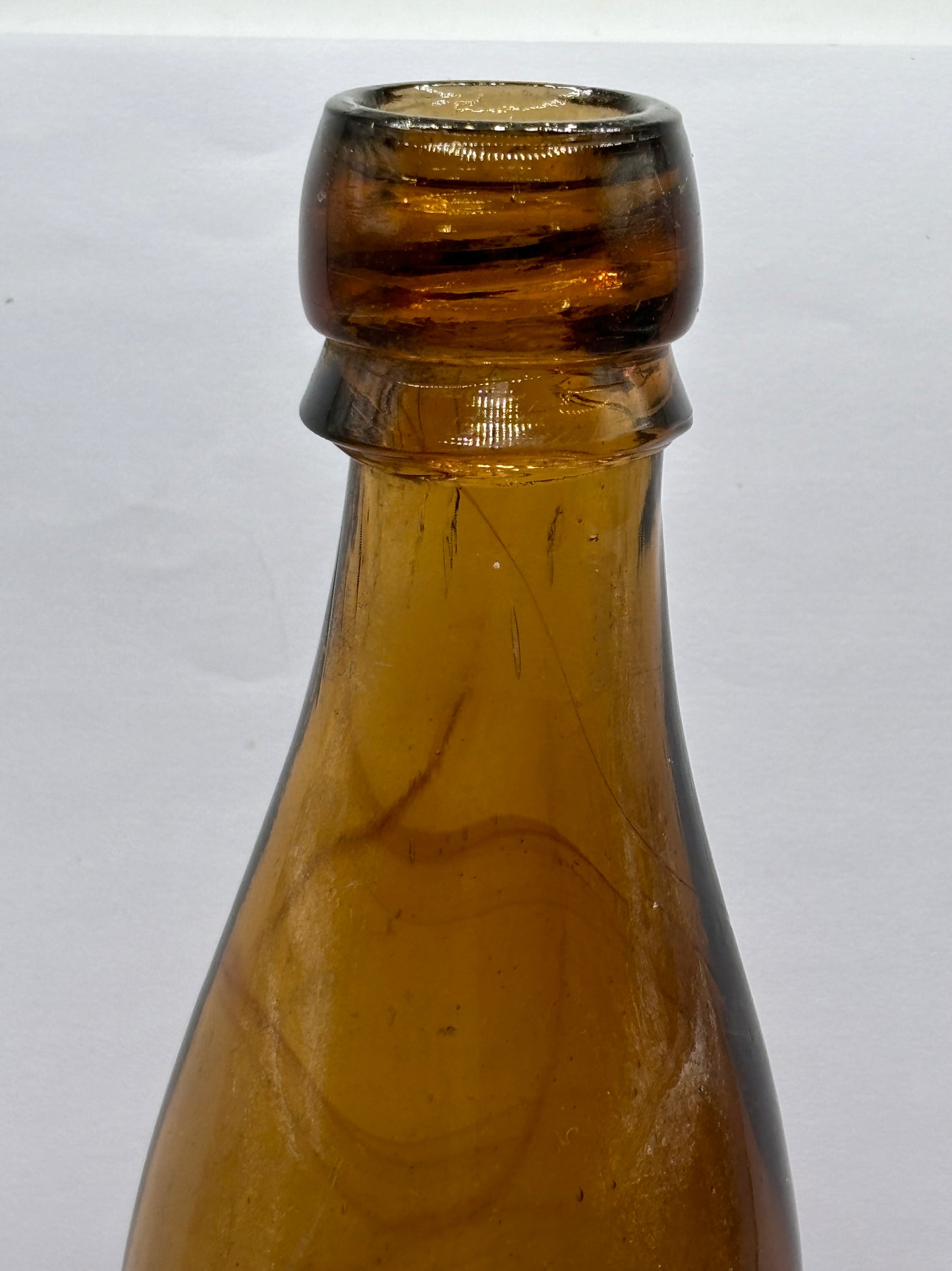 Old amber glass beer bottle, T&J minns Carlisle