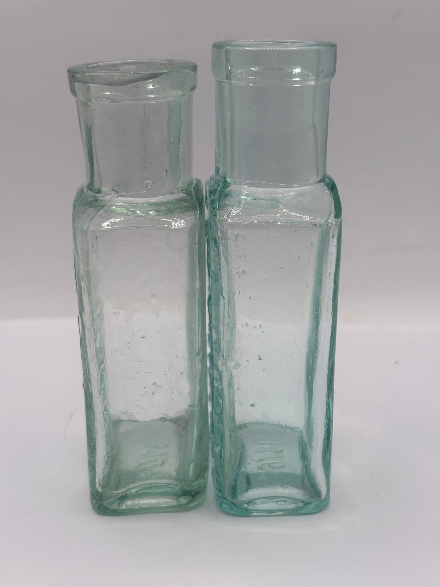 2 Old glass Boots cash chemists bottles