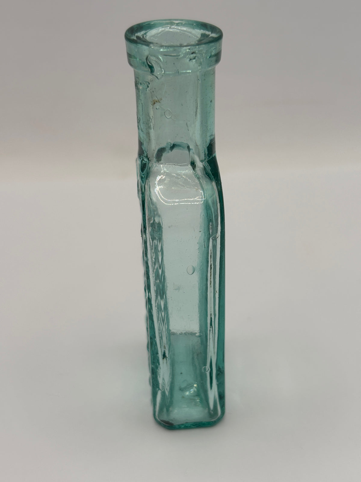 Old aqua glass advertising bottle. Try Pritchards teething powders