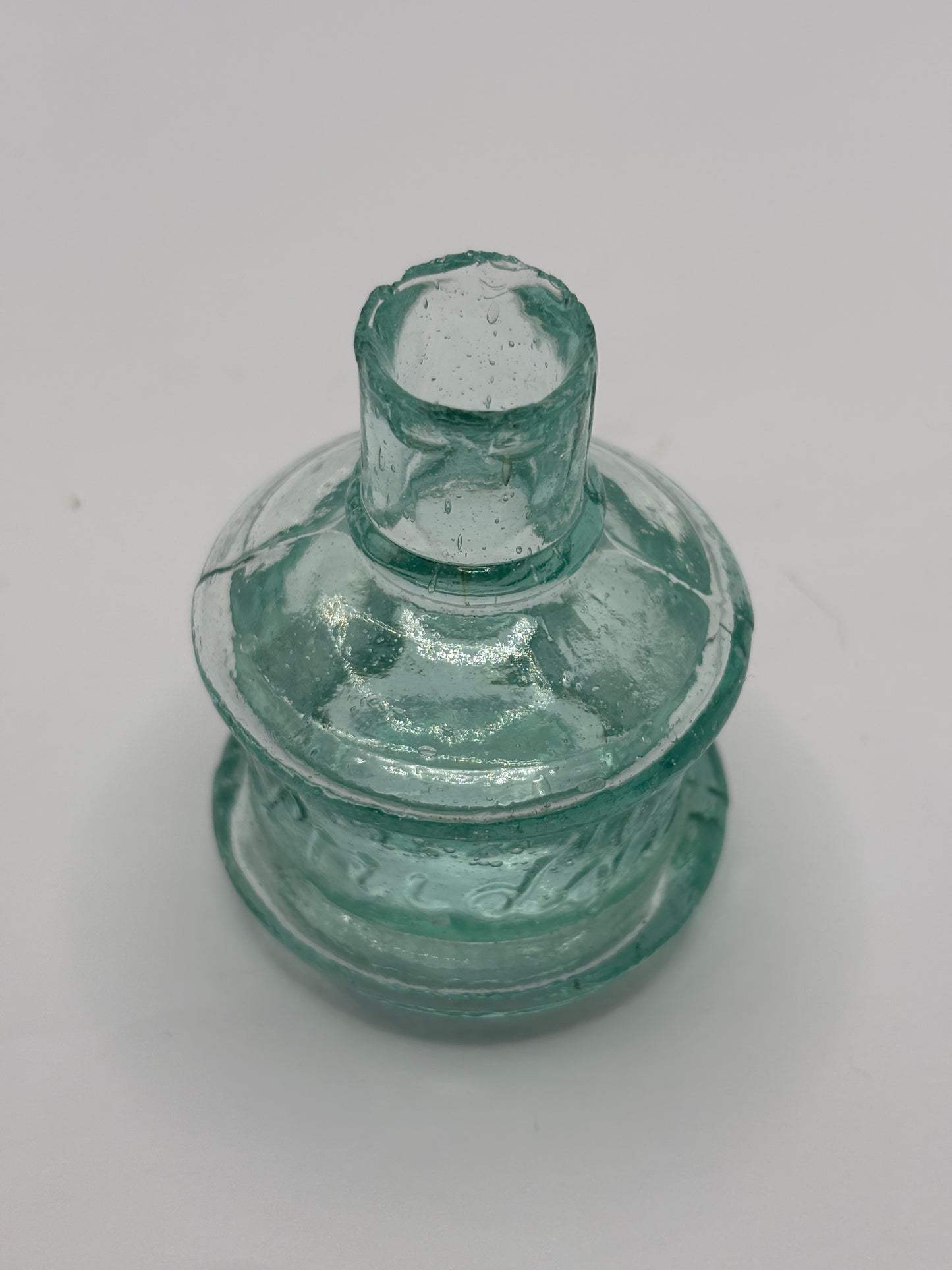 Old aqua glass advertising inkwell, ink bottle. Pridge