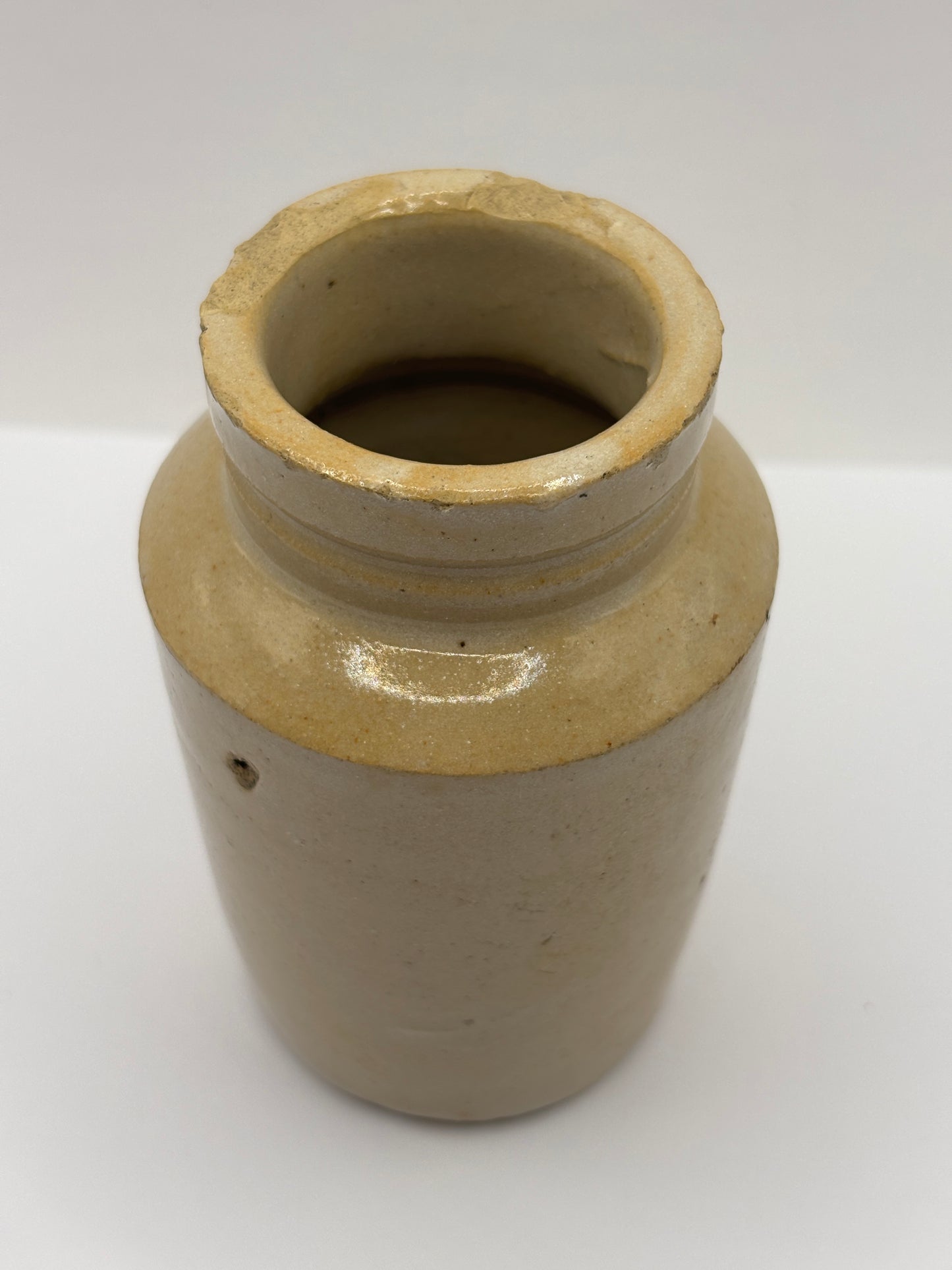 Old plain stoneware cream pot. Chipped