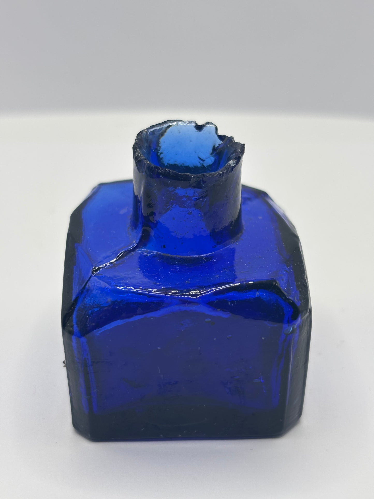 Old cobalt blue glass inkwell, ink bottle