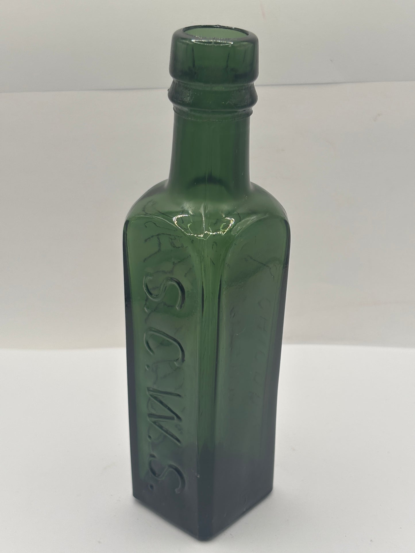 Old green glass essence of coffee & chicory bottle