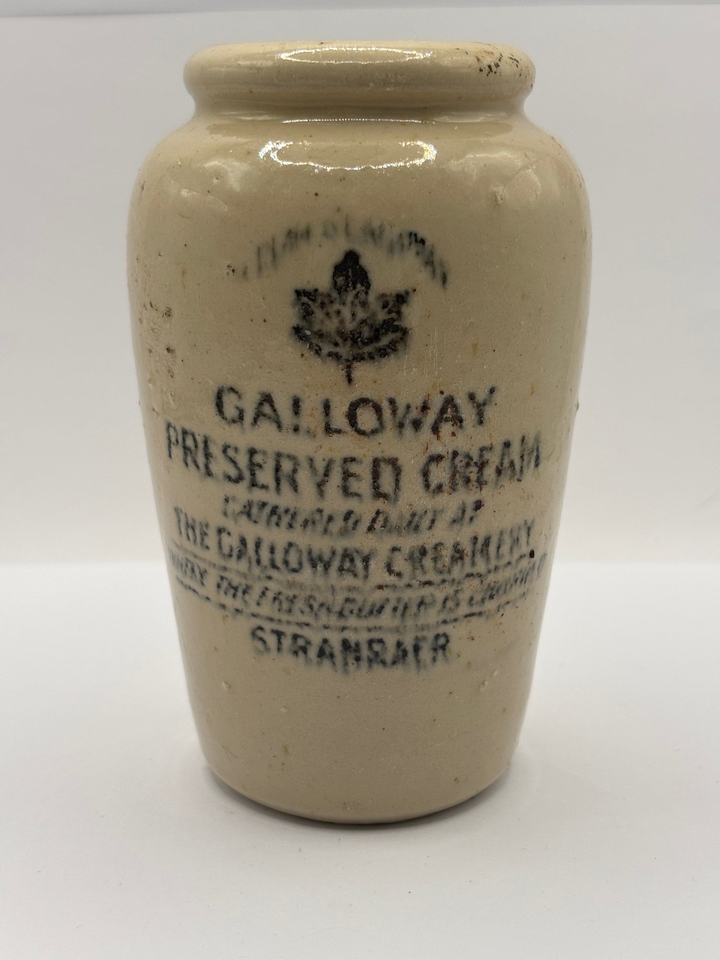 Old advertising cream pot, Galloway creamery Stranraer. Damaged