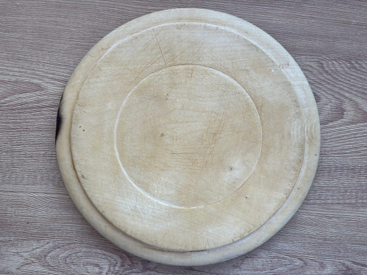 Old wooden carved bread board