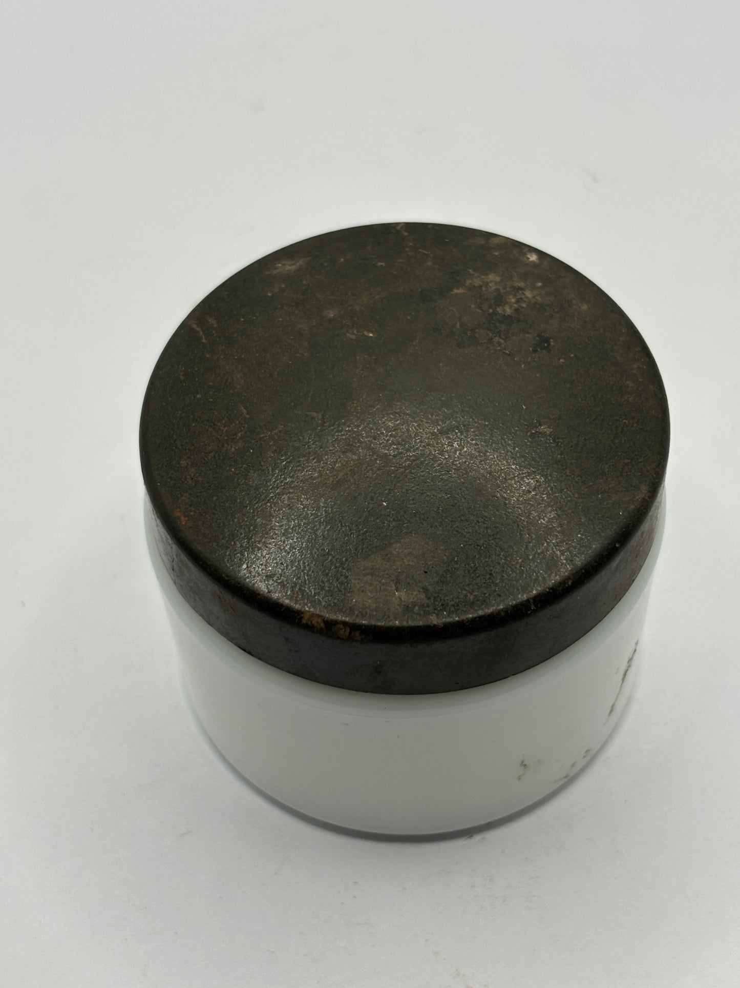 Small milk glass jar with original lid