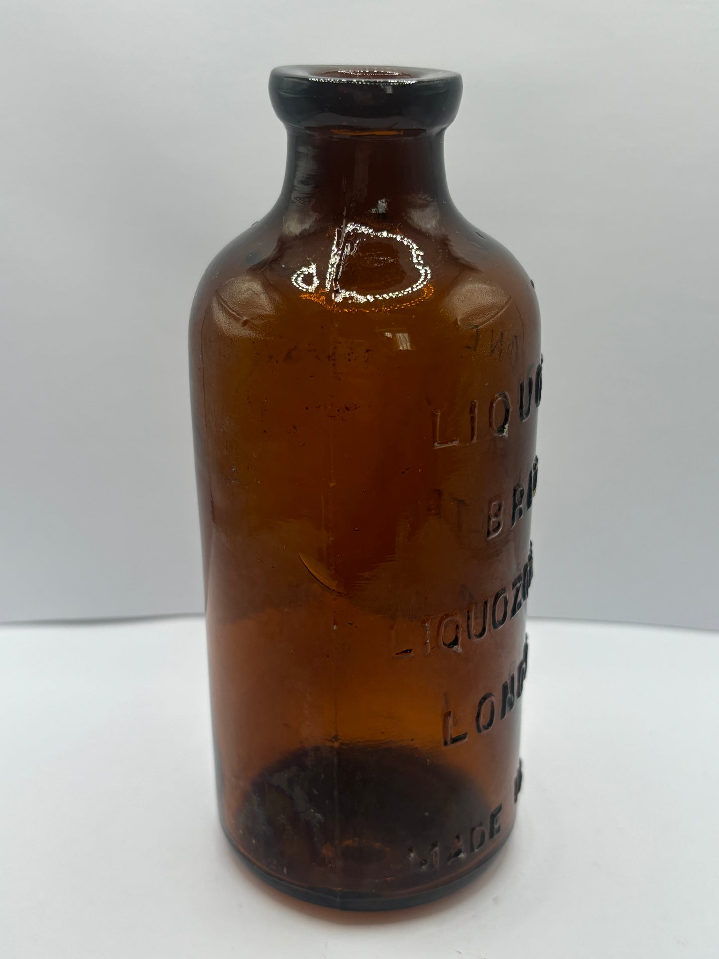 old amber glass liquozone bottle