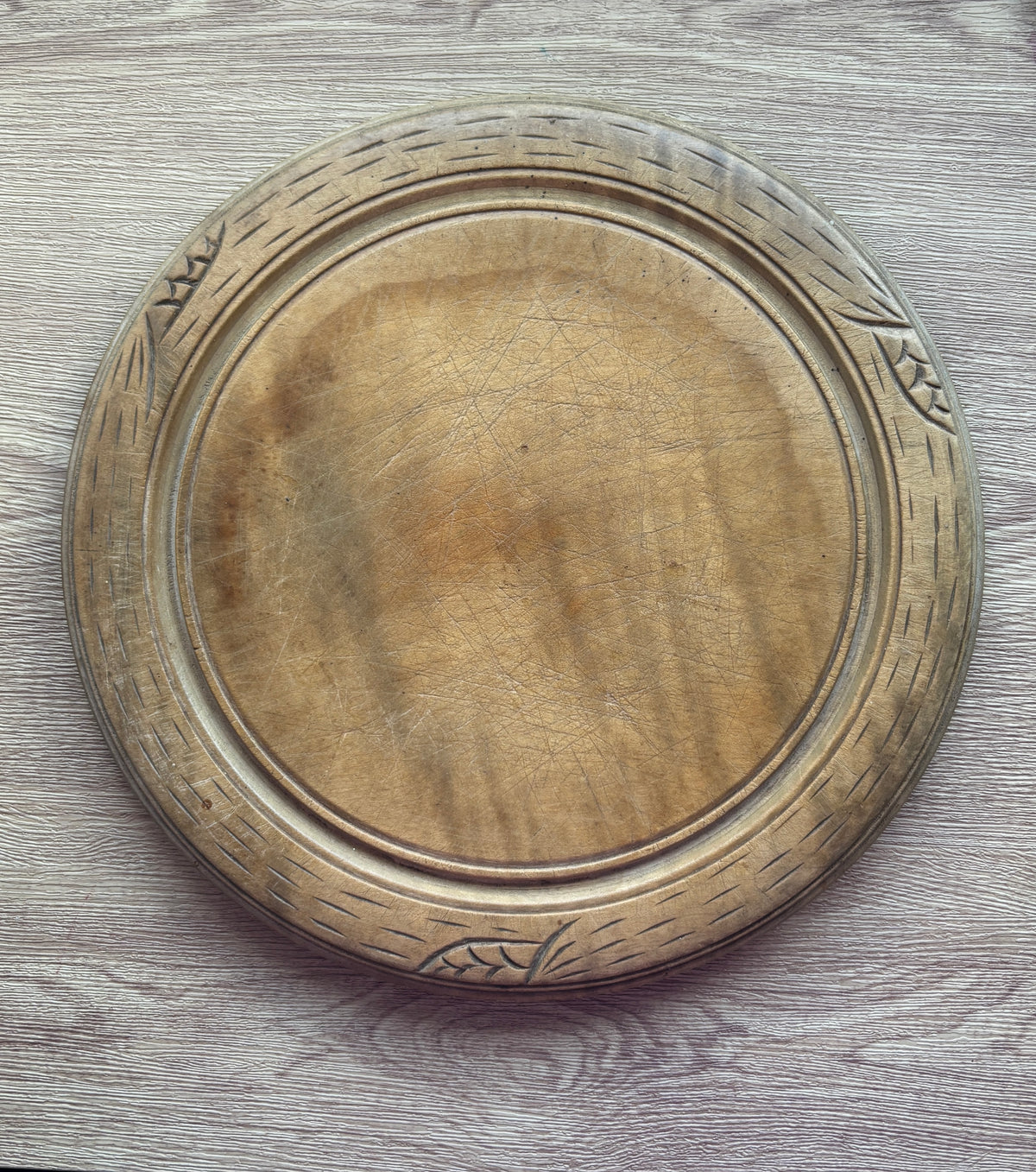 Old wooden carved bread board
