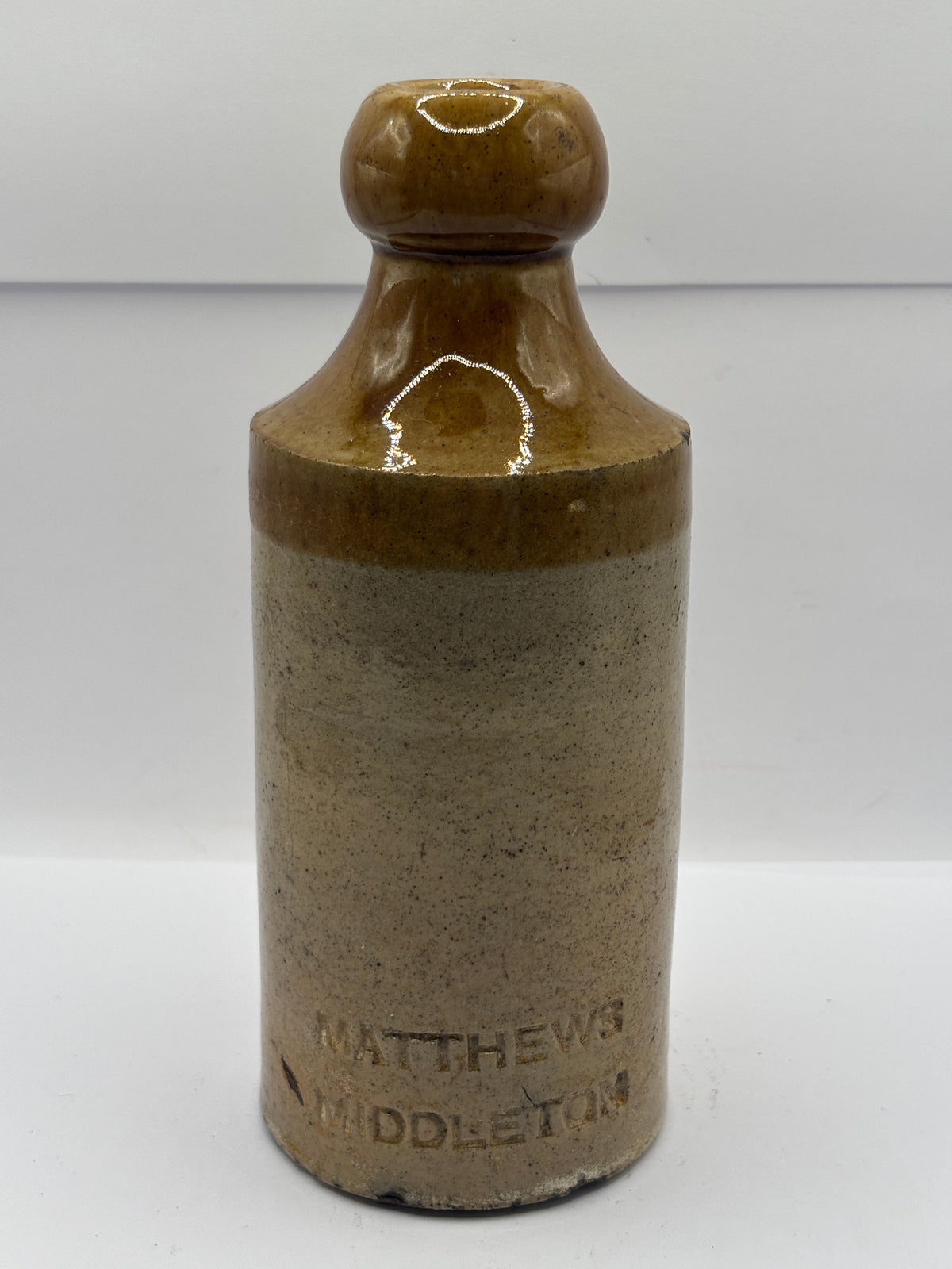 Old impressed stoneware ginger beer bottle, Matthews Middleton