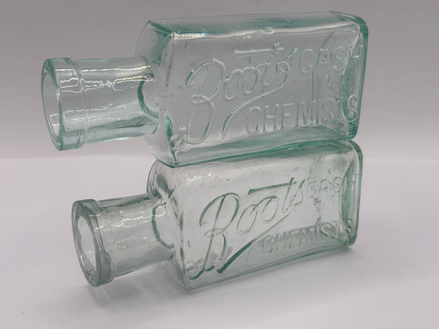 2 Old glass Boots cash chemists bottles