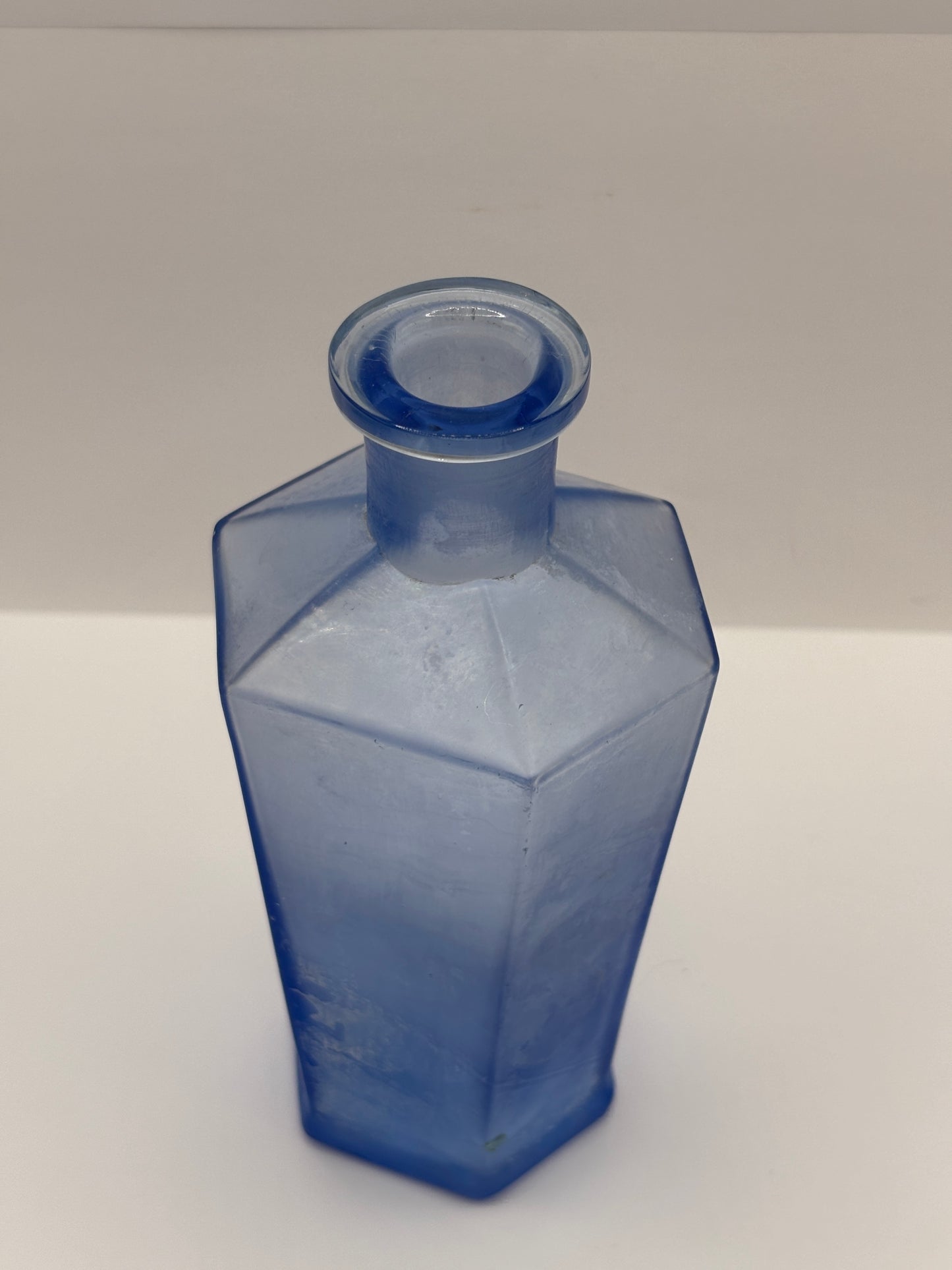 Old unusual blue glass bottle. 6 sided