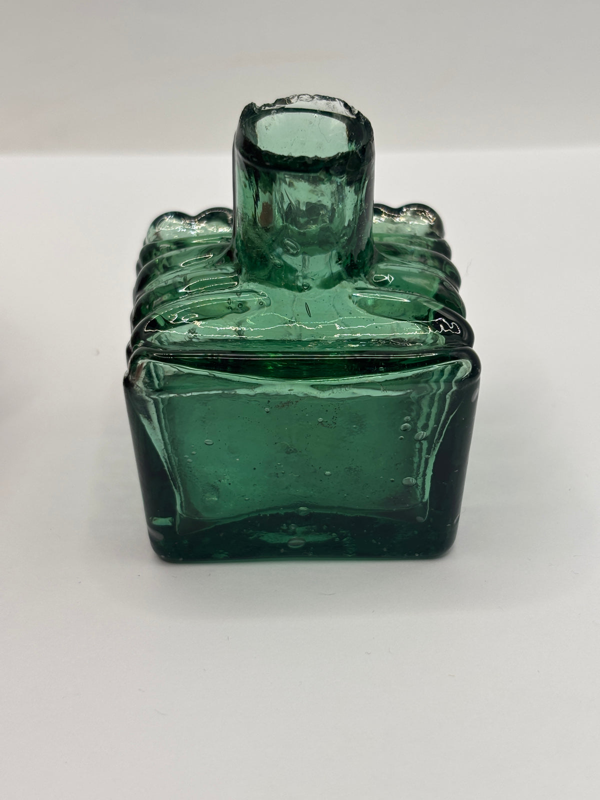 Old dark green glass inkwell, ink bottle, penny ink