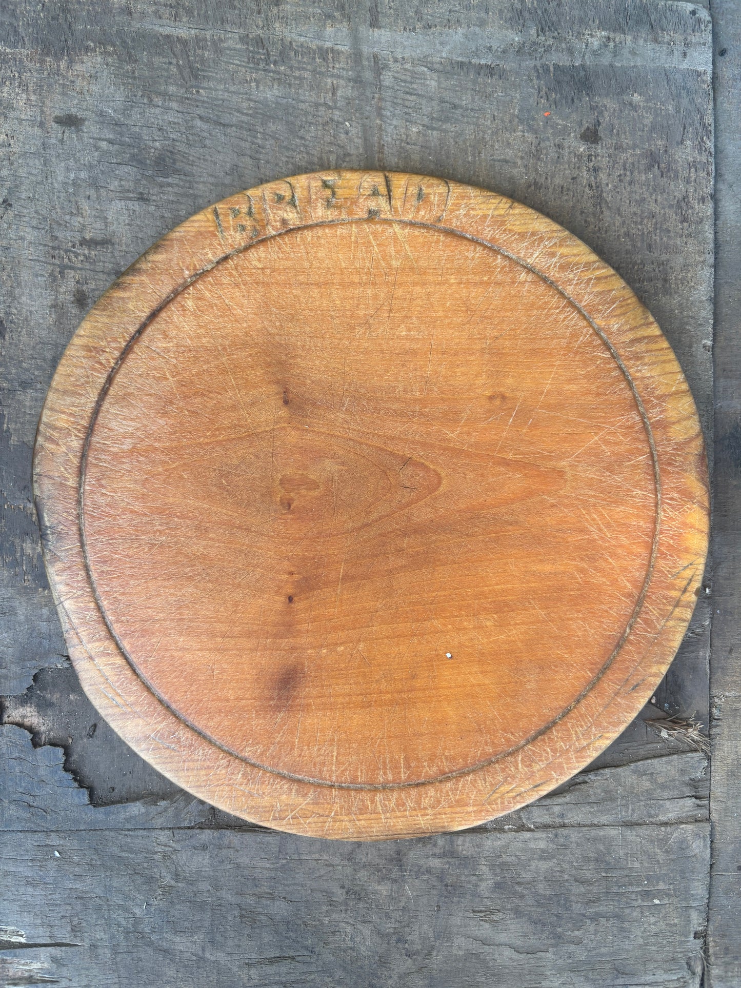 Old wooden carved bread board
