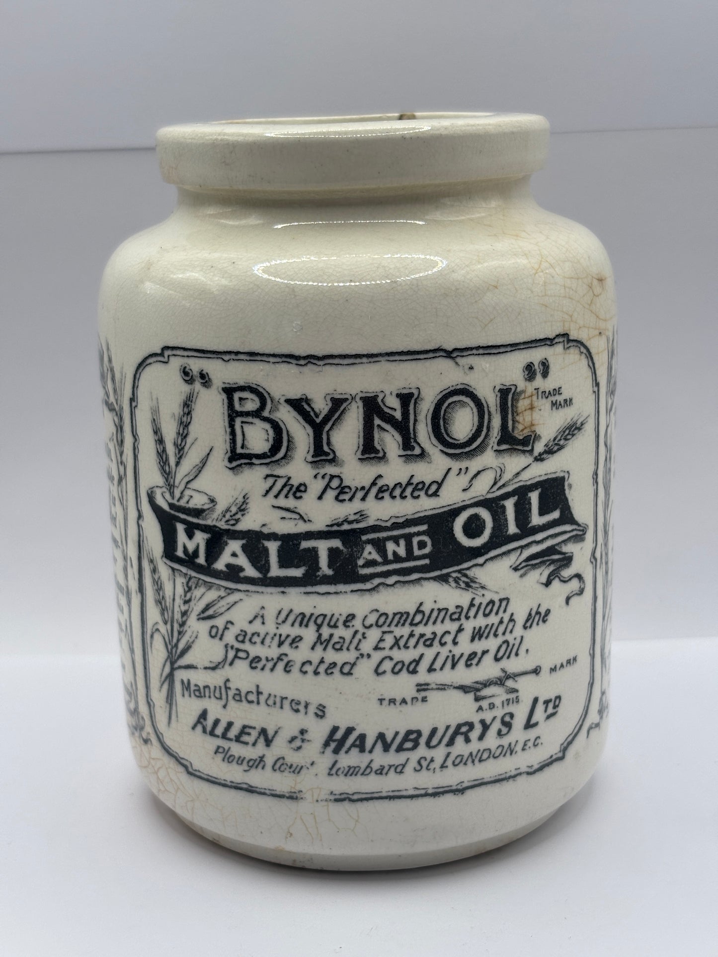 Old stoneware advertising jar, Bynol the perfected malt & oil