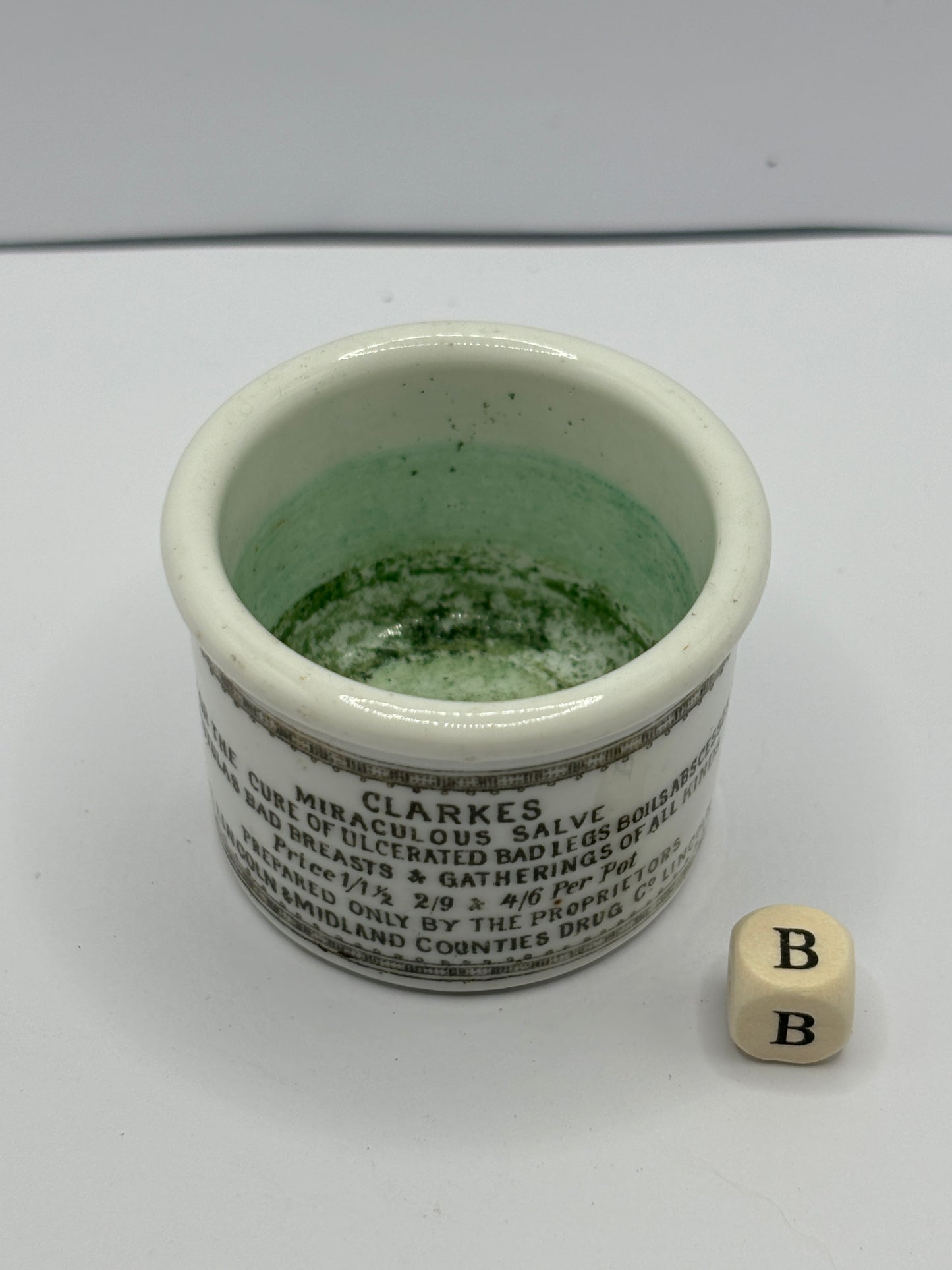 Small Clarke’s miraculous salve advertising ointment pot (b)