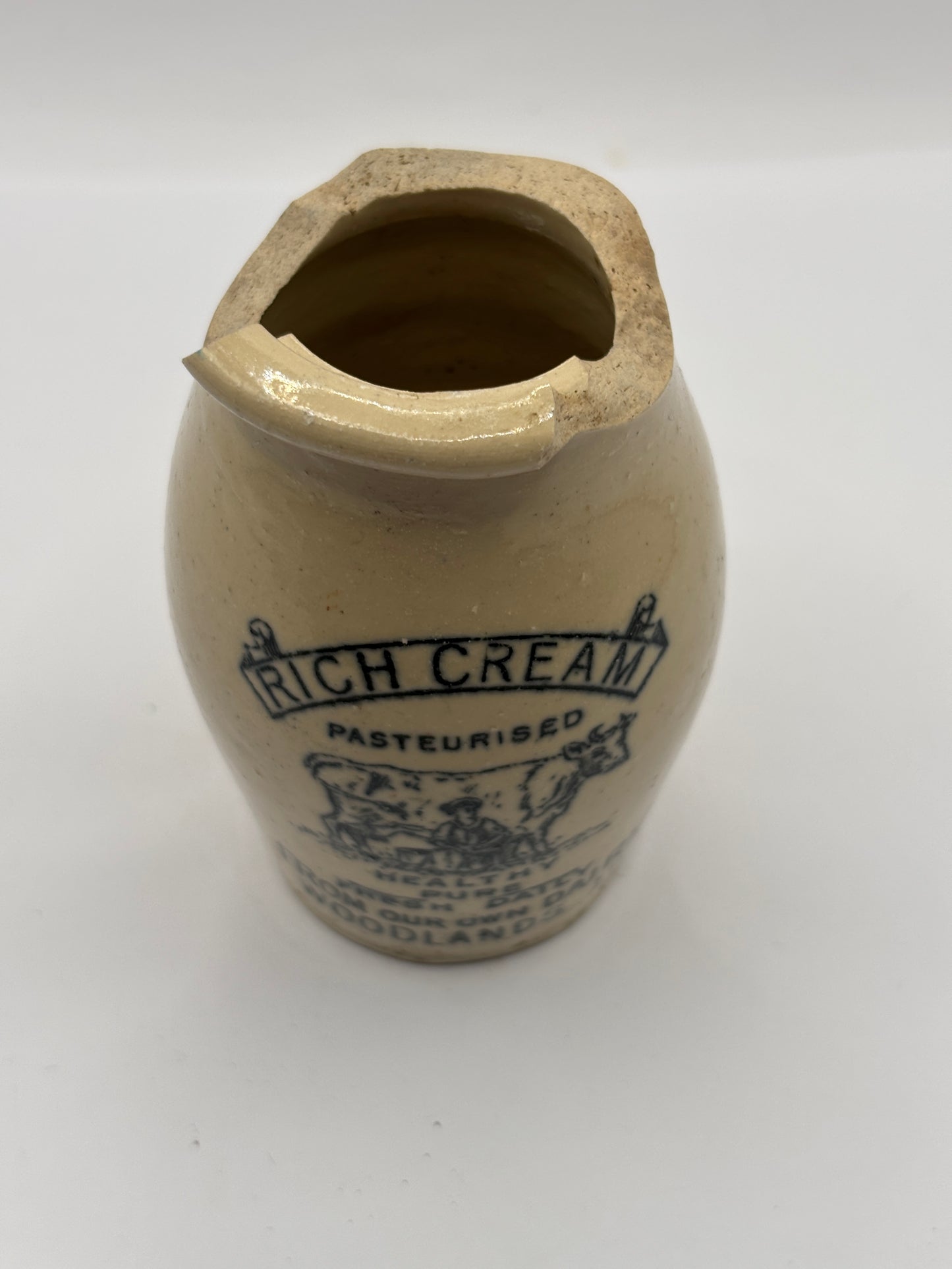 Old advertising cream pot,Woodlands dairy. DAMAGED