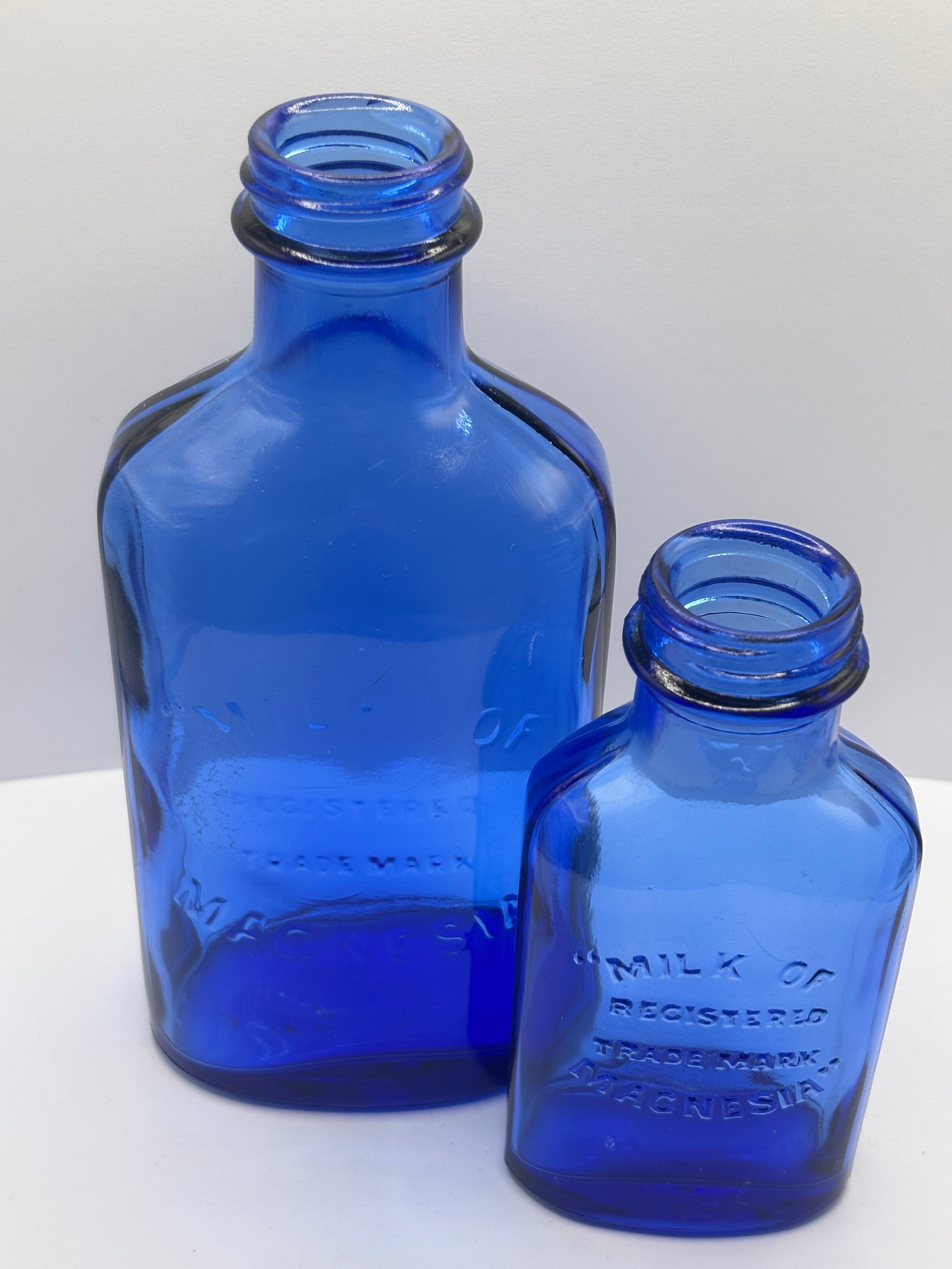 2 vintage Blue milk of magnesia bottles