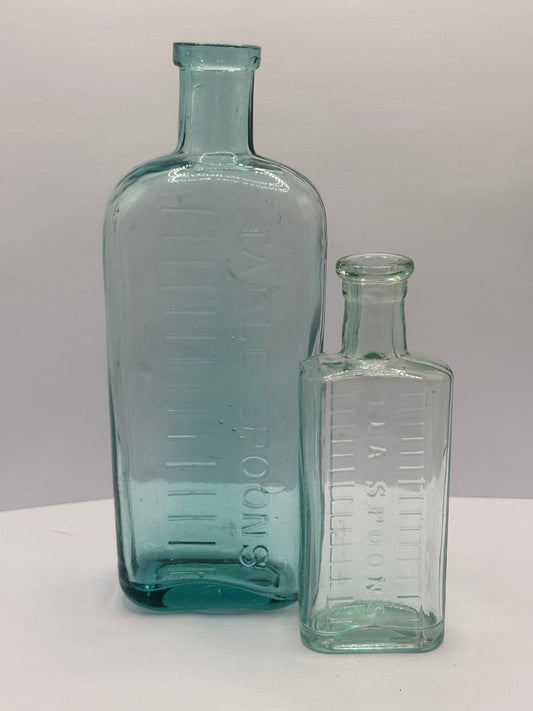 2 old aqua glass tablespoon & teaspoon bottles