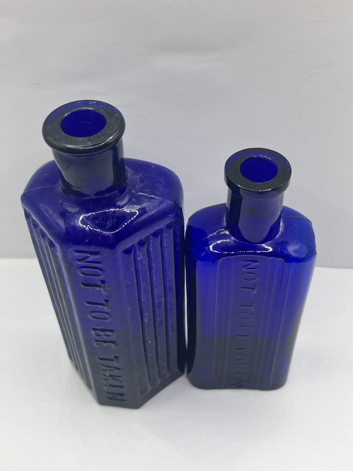 2 blue ribbed poison bottles, Not to be taken