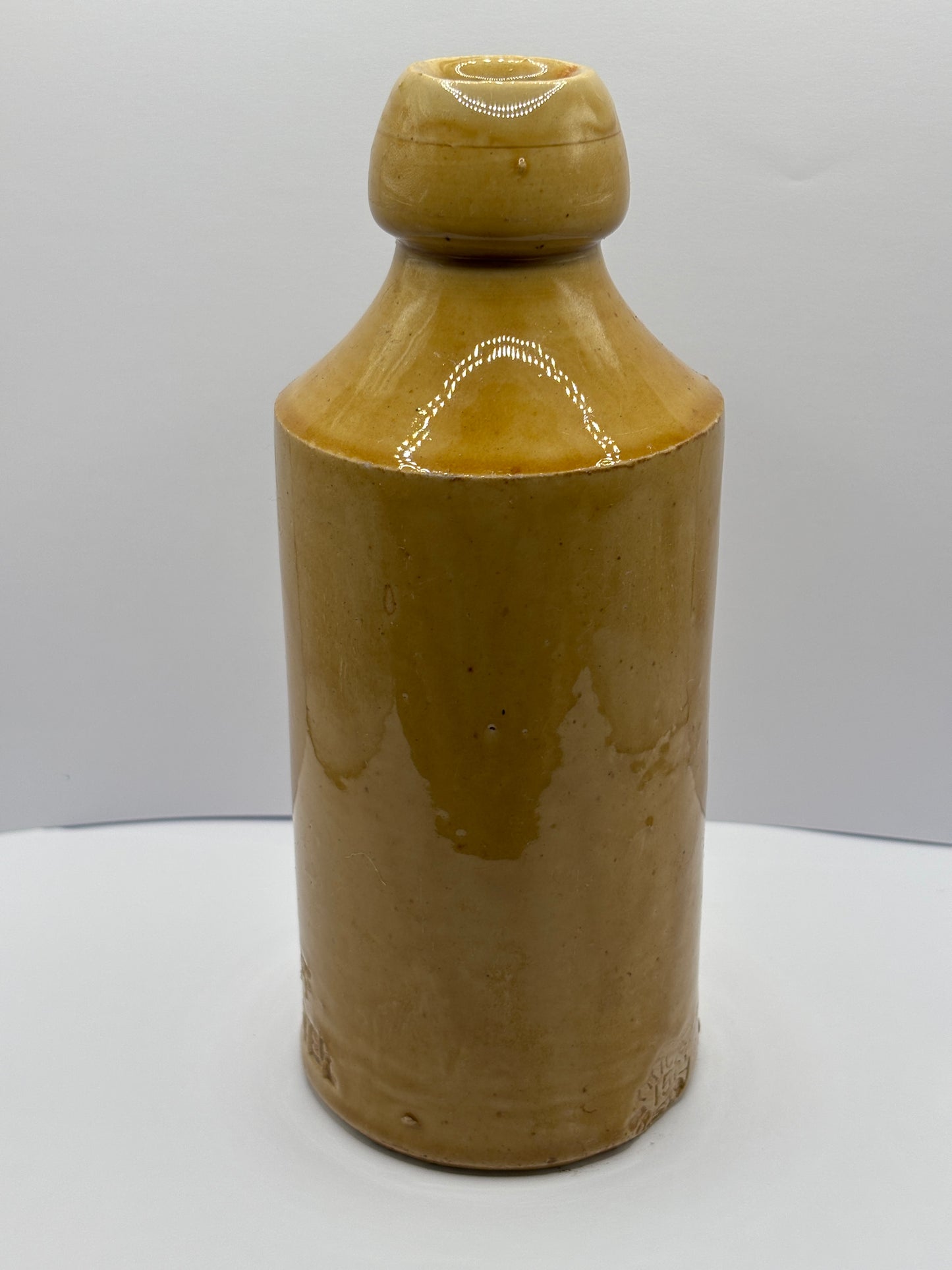 Old impressed stoneware ginger beer bottle, J.H Cuff Manchester