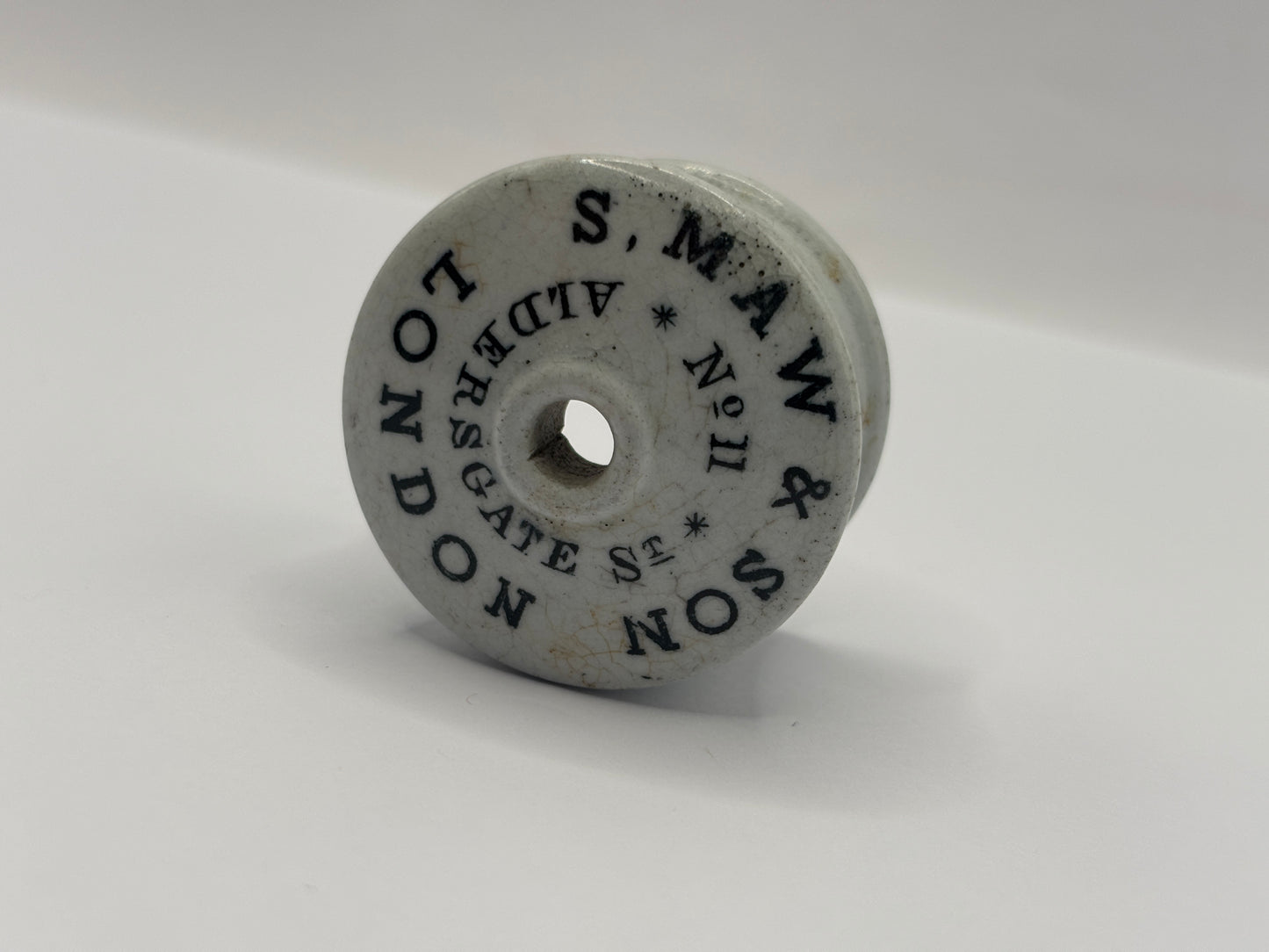 Old advertising baby feeder lid, S maw & son