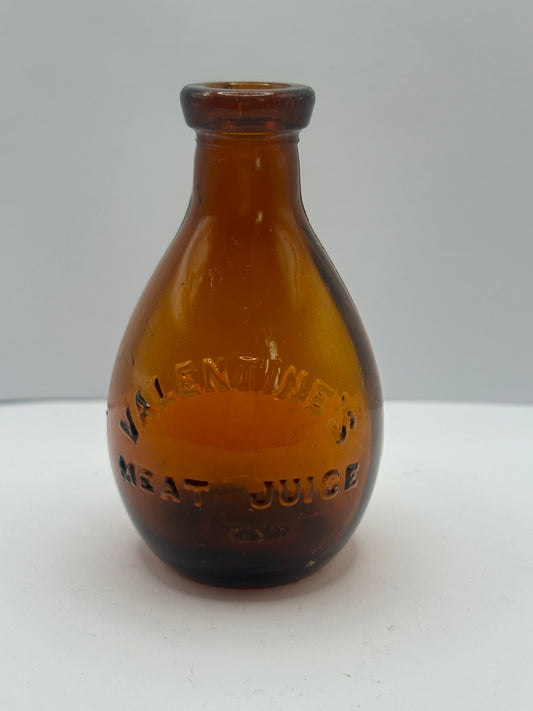 Small old amber glass valentines meat juices bottle