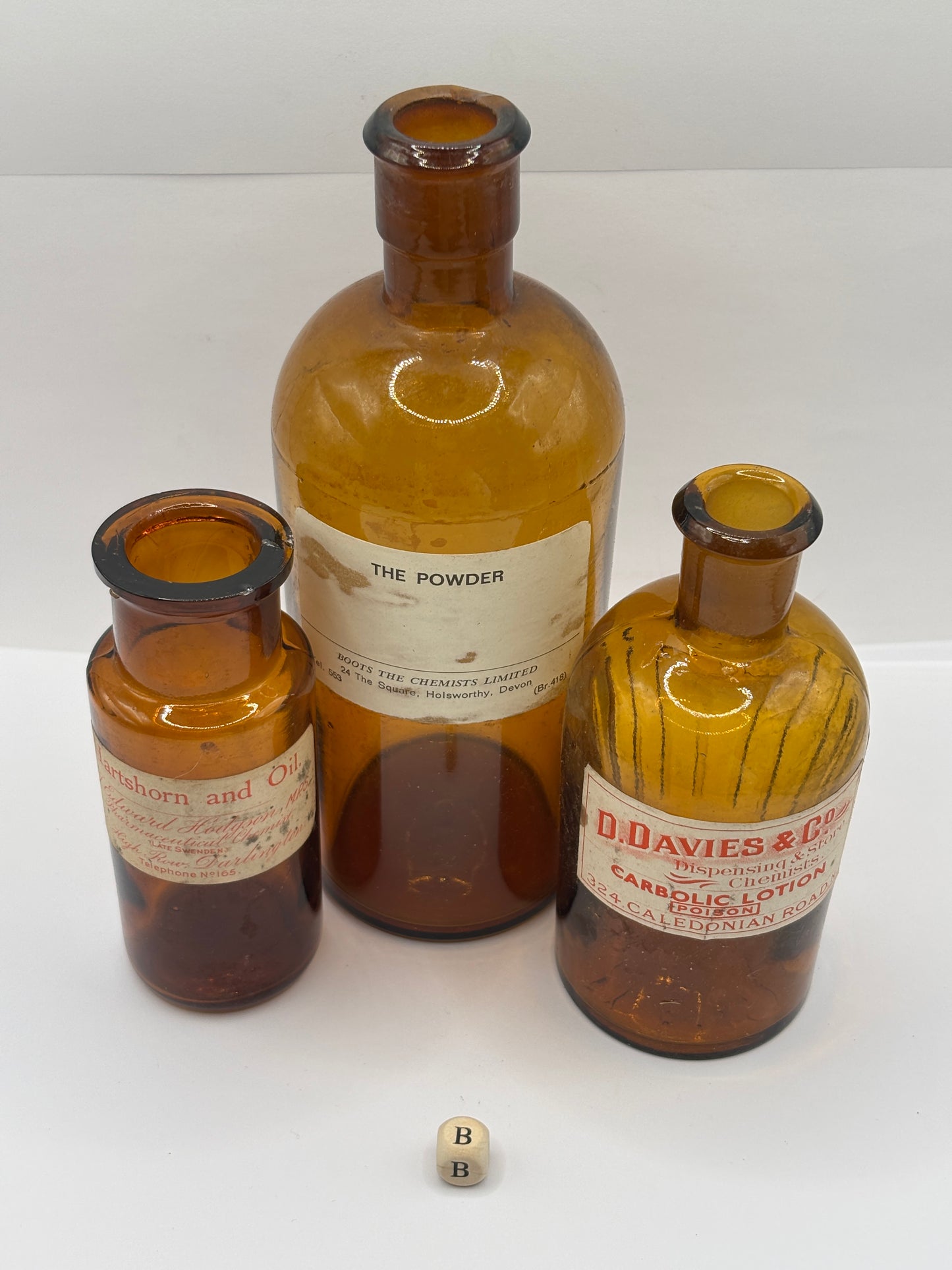 3 old chemist bottles with added labels (B)