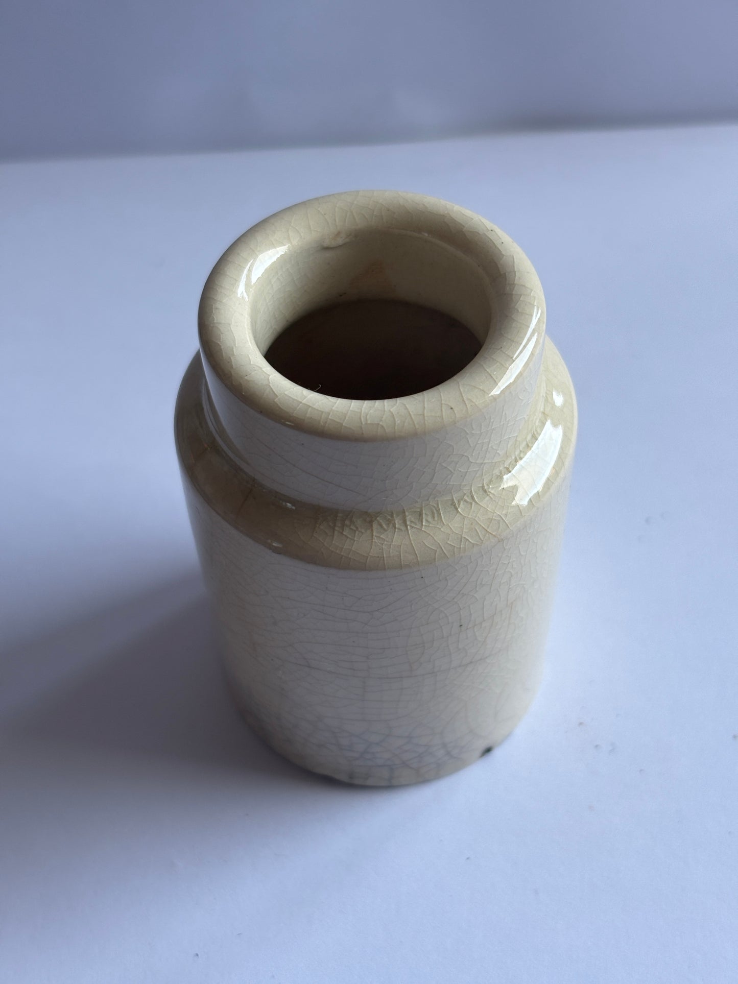 Old white stoneware pot