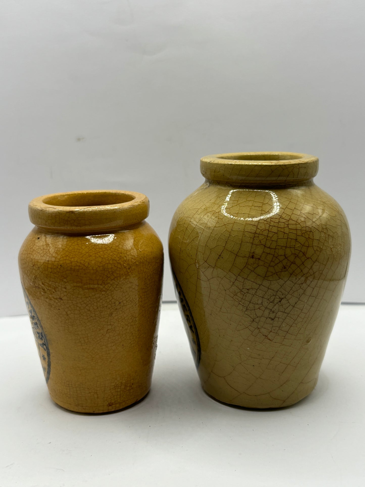 2 advertising cream pots, Stained & crazed