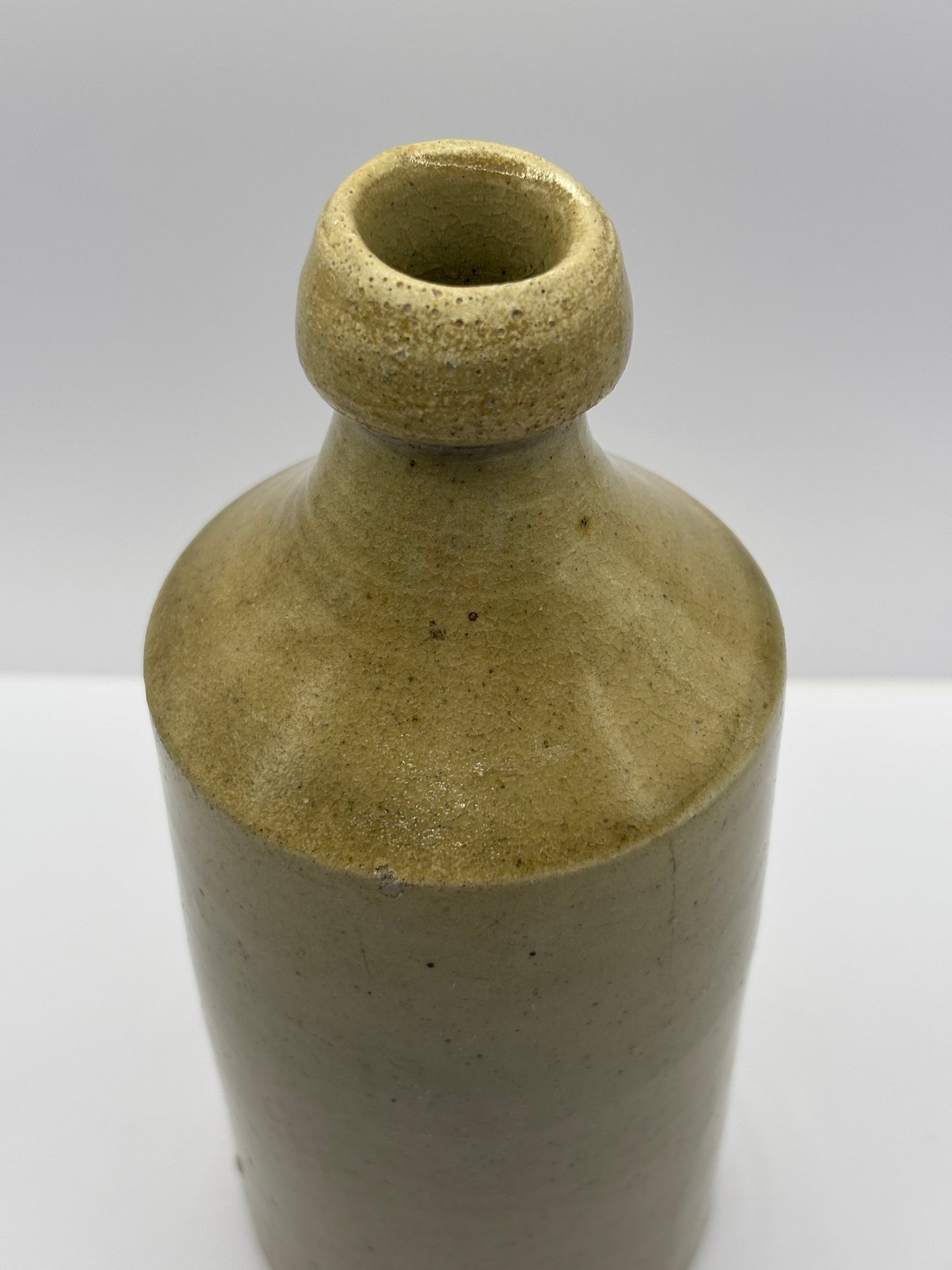 Early plain stoneware ginger beer bottle
