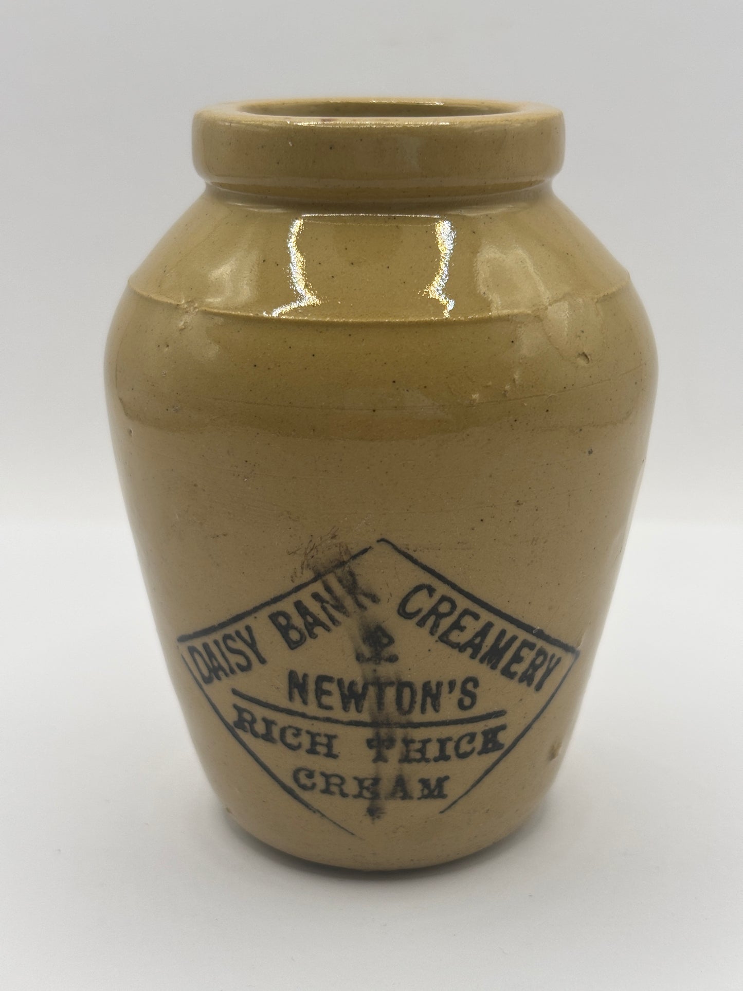 Old advertising cream pot, Daisy Bank creamery. Newton’s rich thick cream