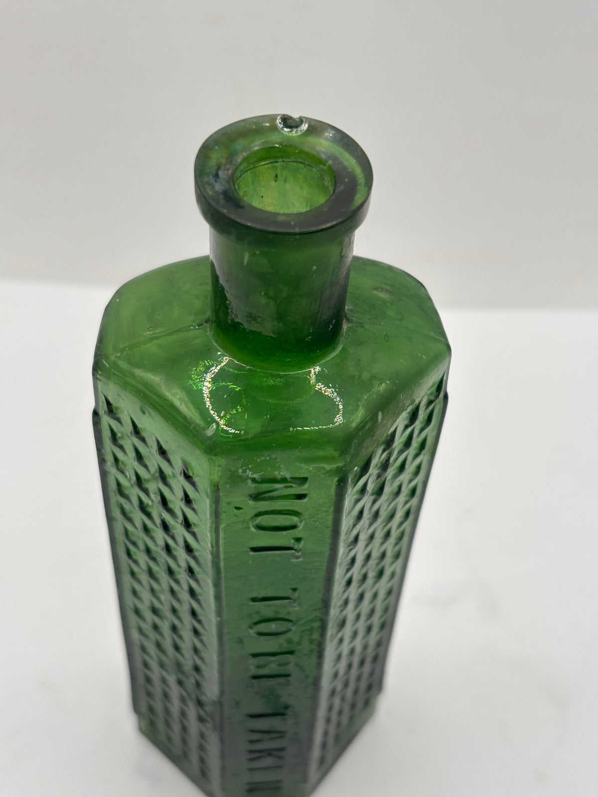 Old crusty green flat back poison bottle, Not to be taken