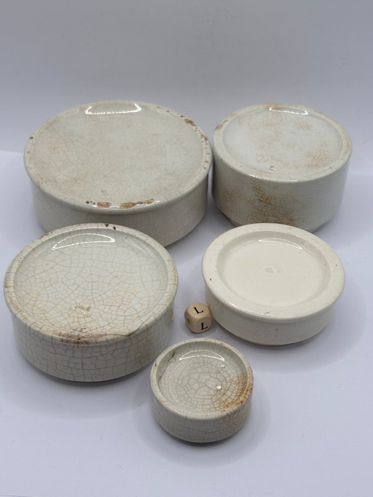 5 old stoneware pot lid bases, stackers (L)