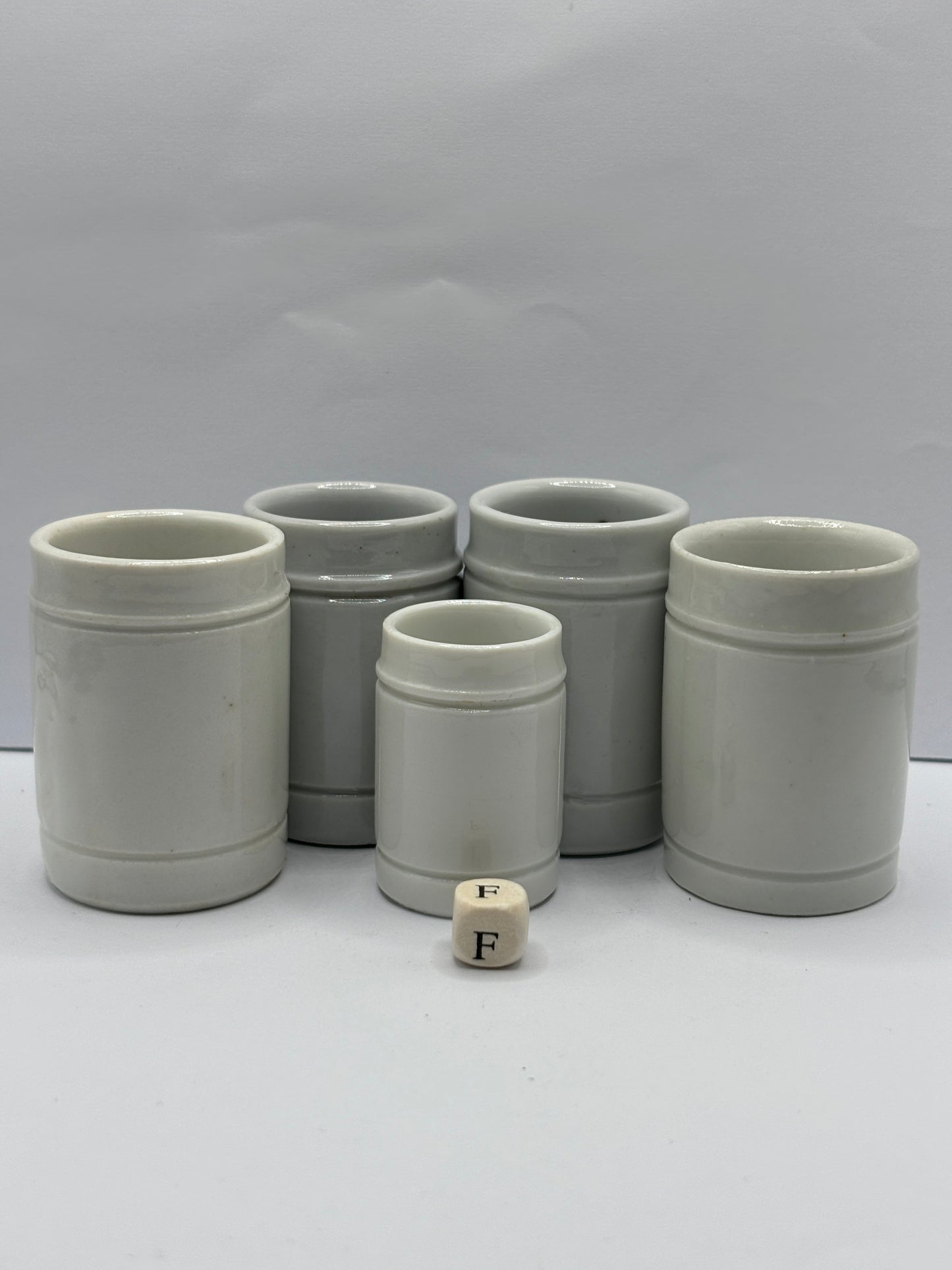 5 small white stoneware pots (F)