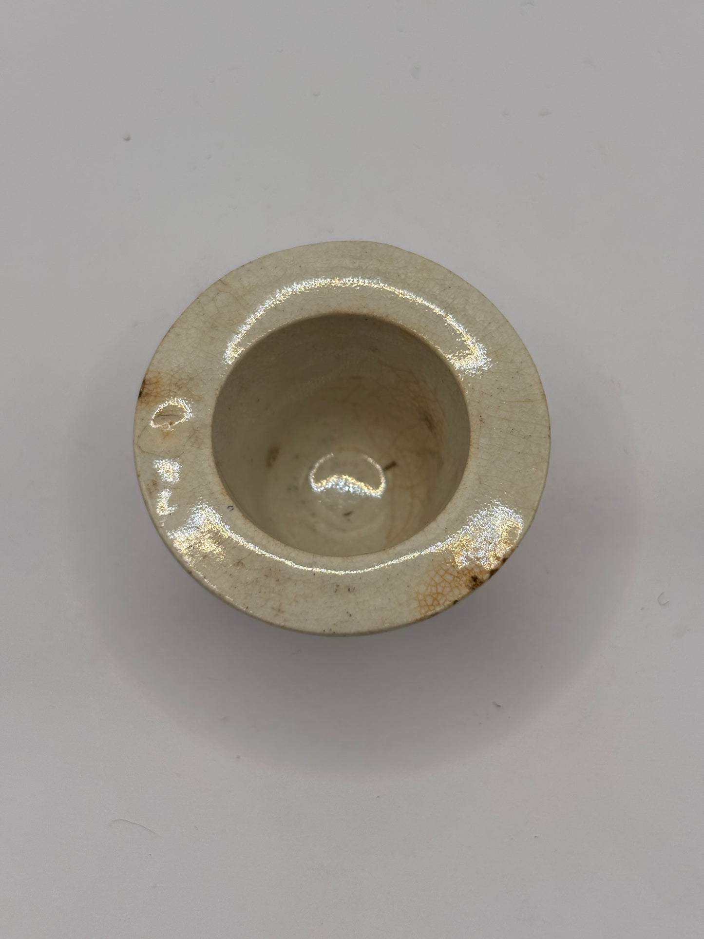 Old white stoneware school desk inkwell
