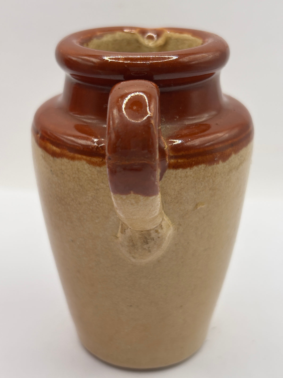 Old advertising cream pot, Bannisters Huddersfield dairies. Repaired handle