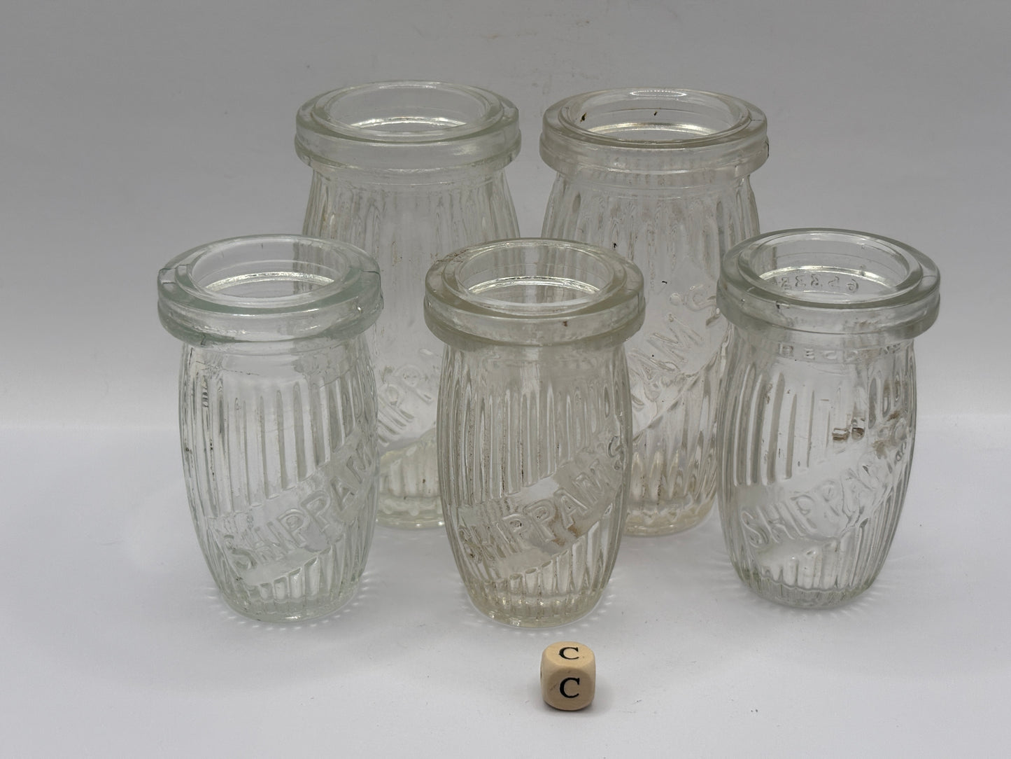 5 old clear glass meat paste jars (c)